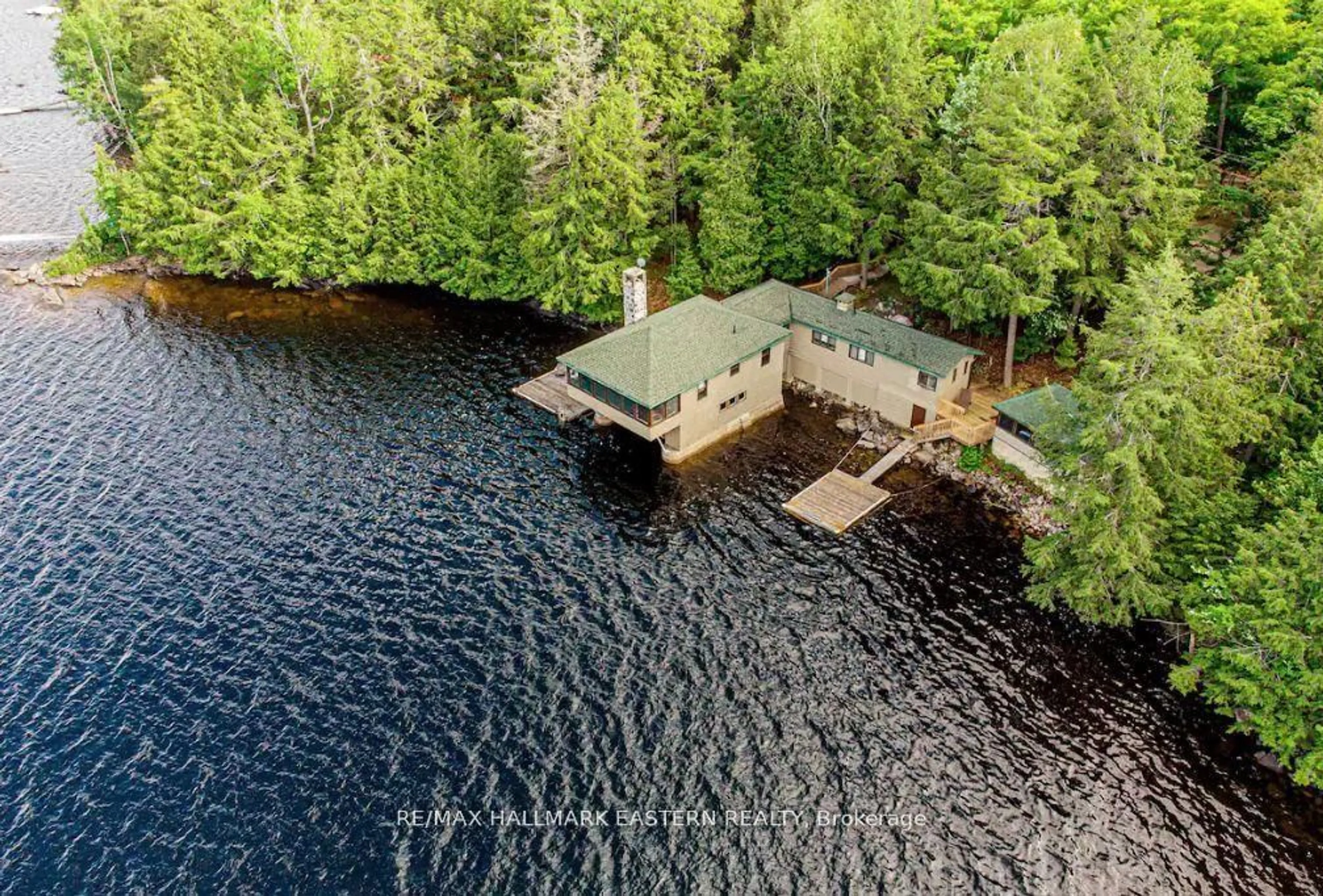 A pic from outside/outdoor area/front of a property/back of a property/a pic from drone, water/lake/river/ocean view for 7 Fire Route 277C N/A, Trent Lakes Ontario K0L 1J0