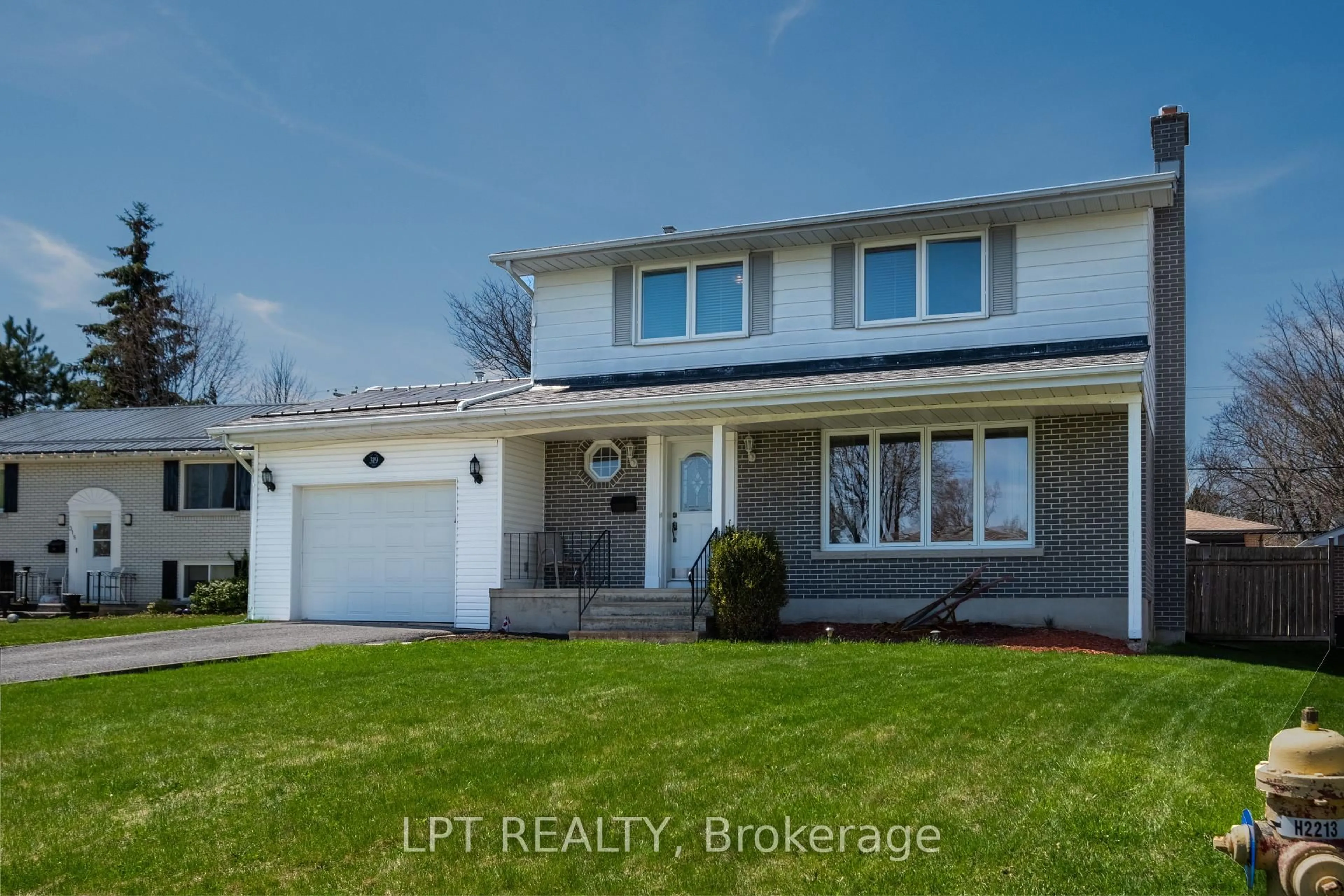 Home with vinyl exterior material, street for 319 Glen Cairn Terr, Kingston Ontario K7M 4A6