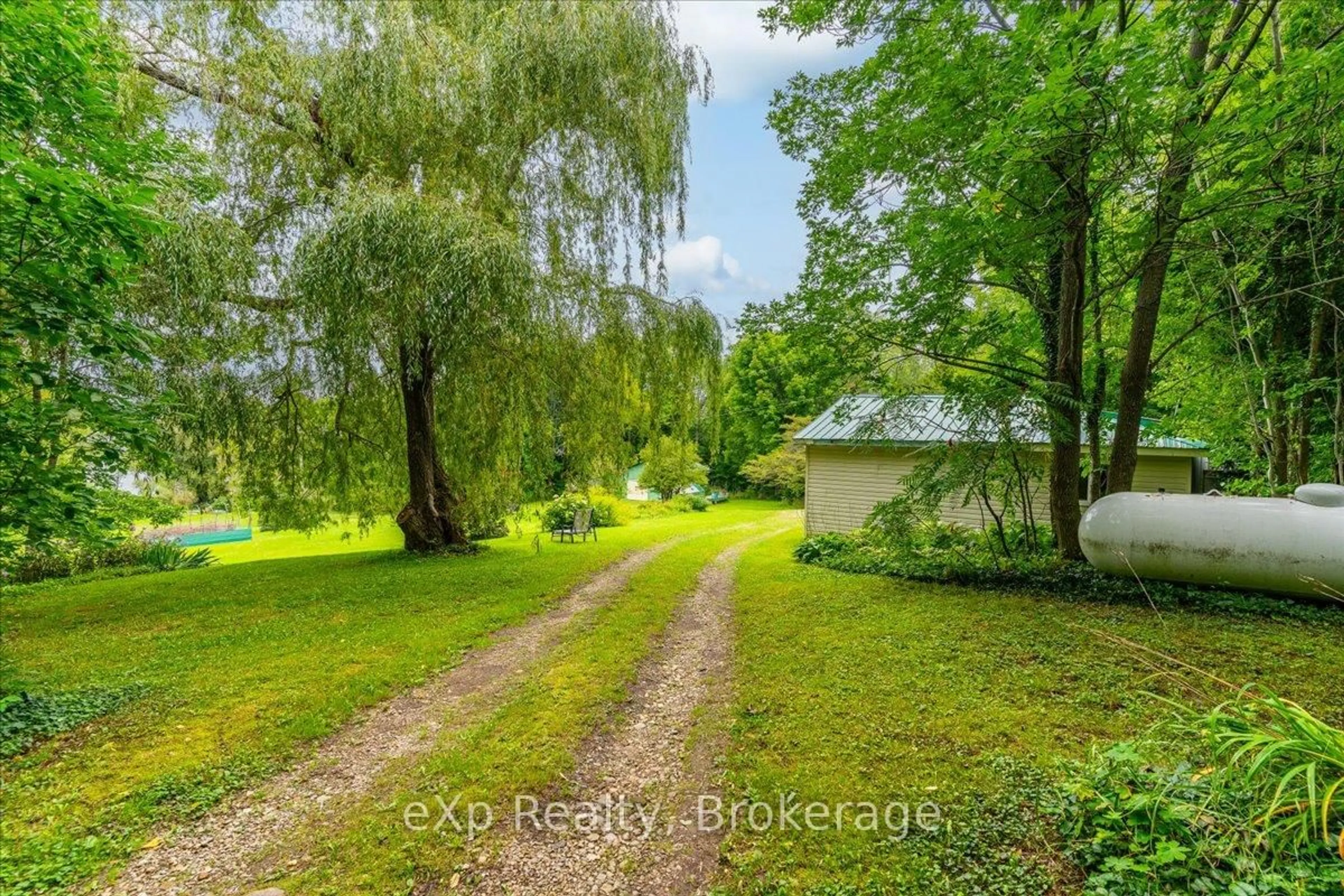 A pic from outside/outdoor area/front of a property/back of a property/a pic from drone, forest/trees view for 126 OLD MILL Rd, Georgian Bluffs Ontario N0H 2T0