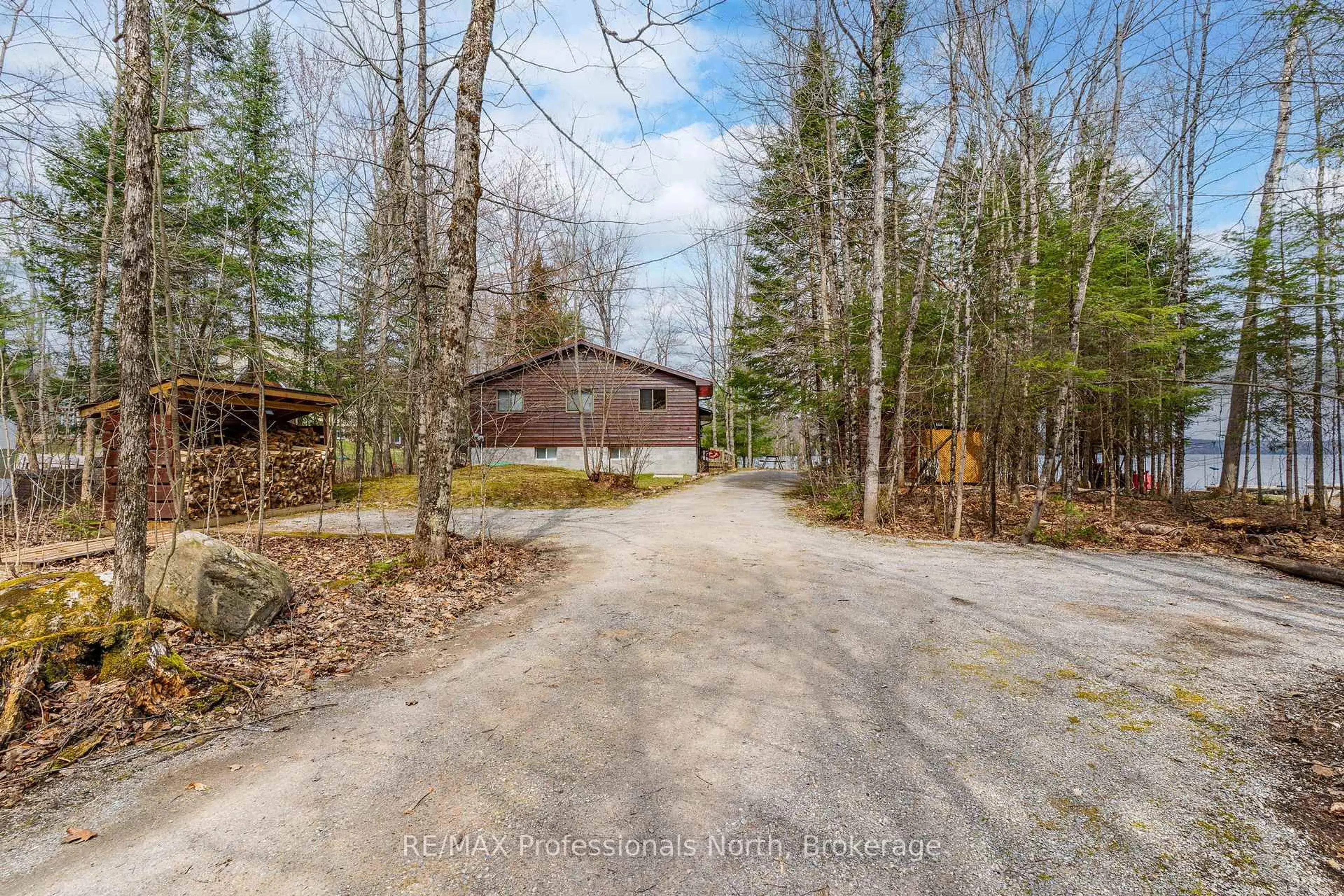 A pic from outside/outdoor area/front of a property/back of a property/a pic from drone, unknown for 1011 Serpentine Lane, Minden Hills Ontario K0M 2K0