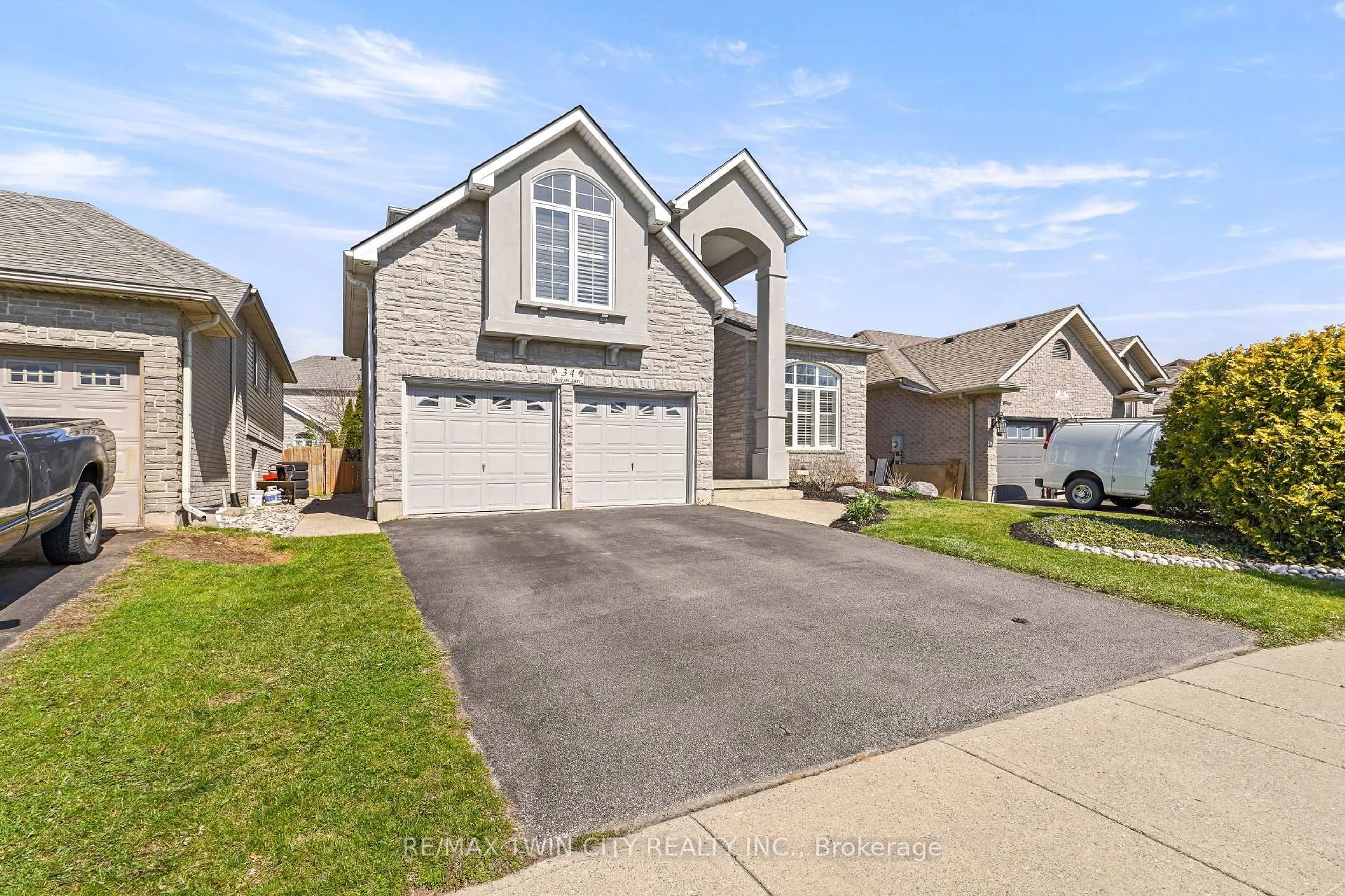 Home with brick exterior material, street for 34 Jackson Lane, Brantford Ontario N3R 7Z7
