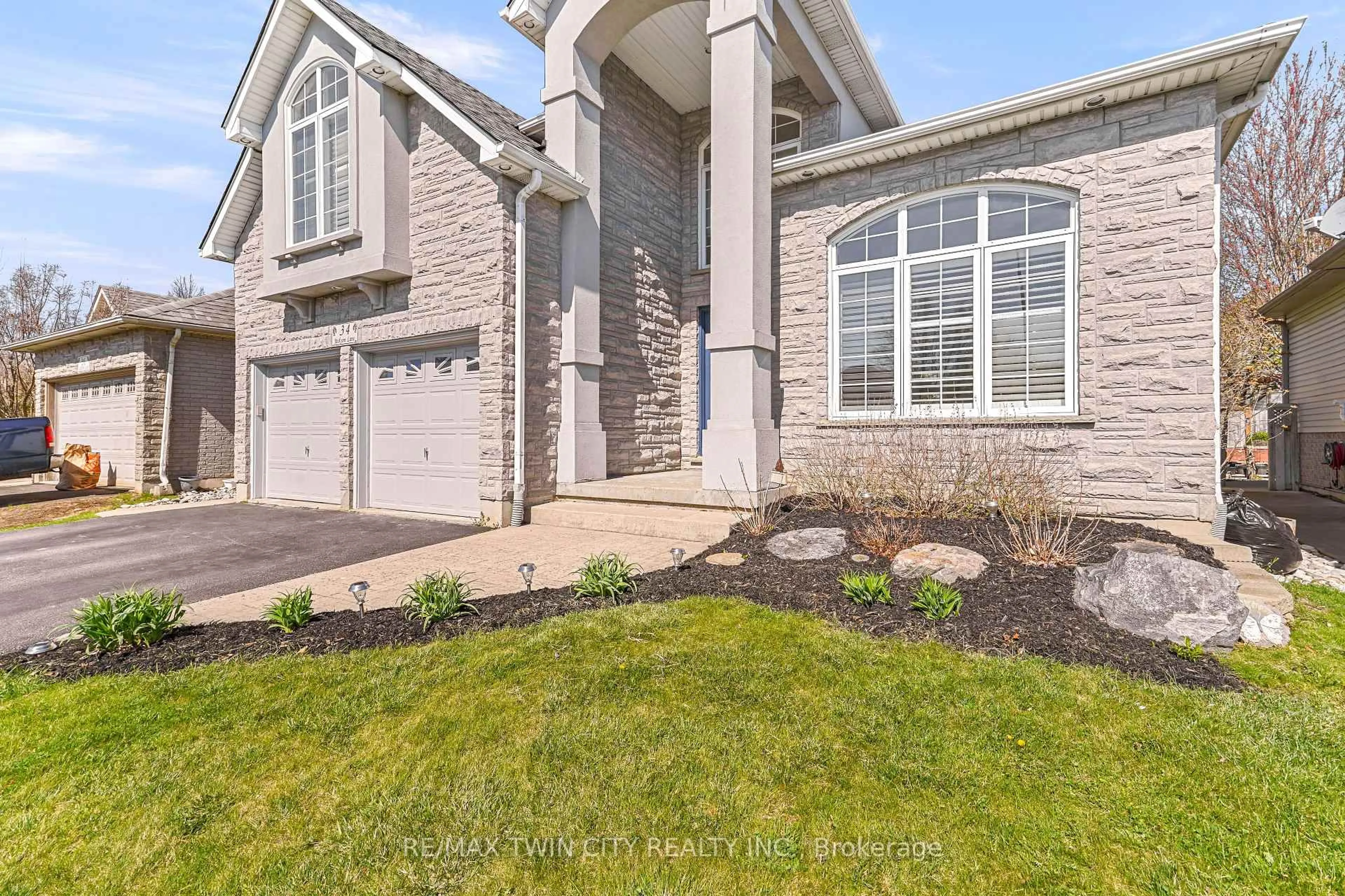 Home with brick exterior material, street for 34 Jackson Lane, Brantford Ontario N3R 7Z7
