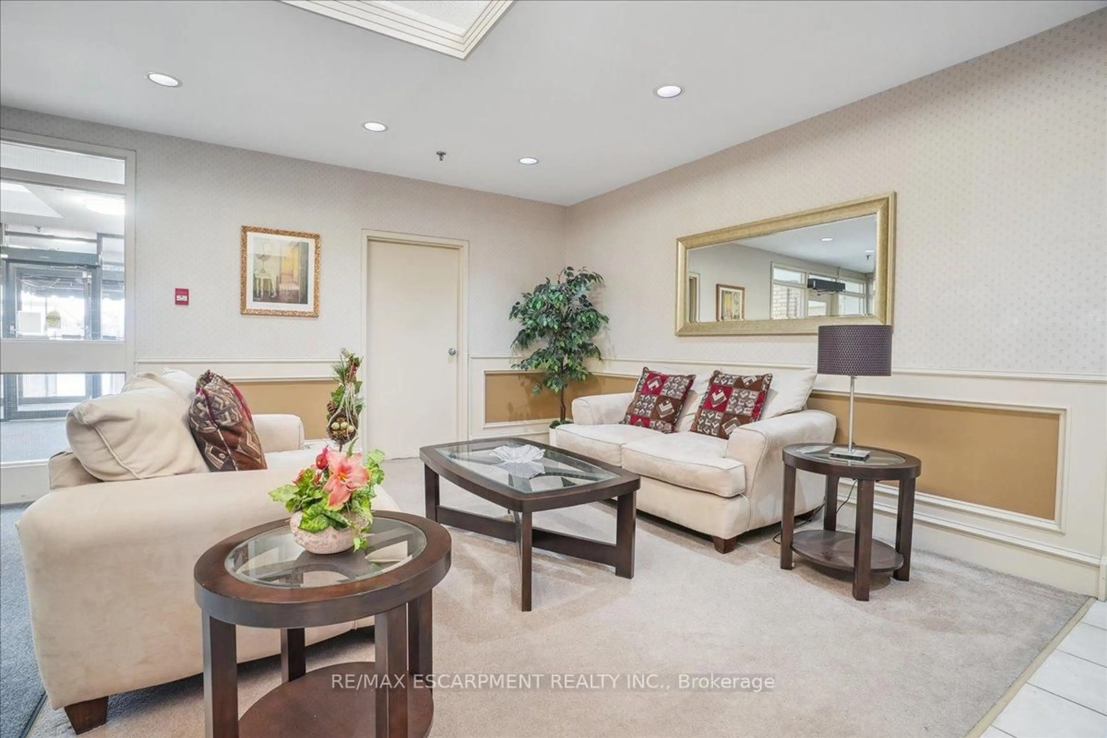 Living room with furniture, ceramic/tile floor for 432 Main St #504, Hamilton Ontario L8N 1J9
