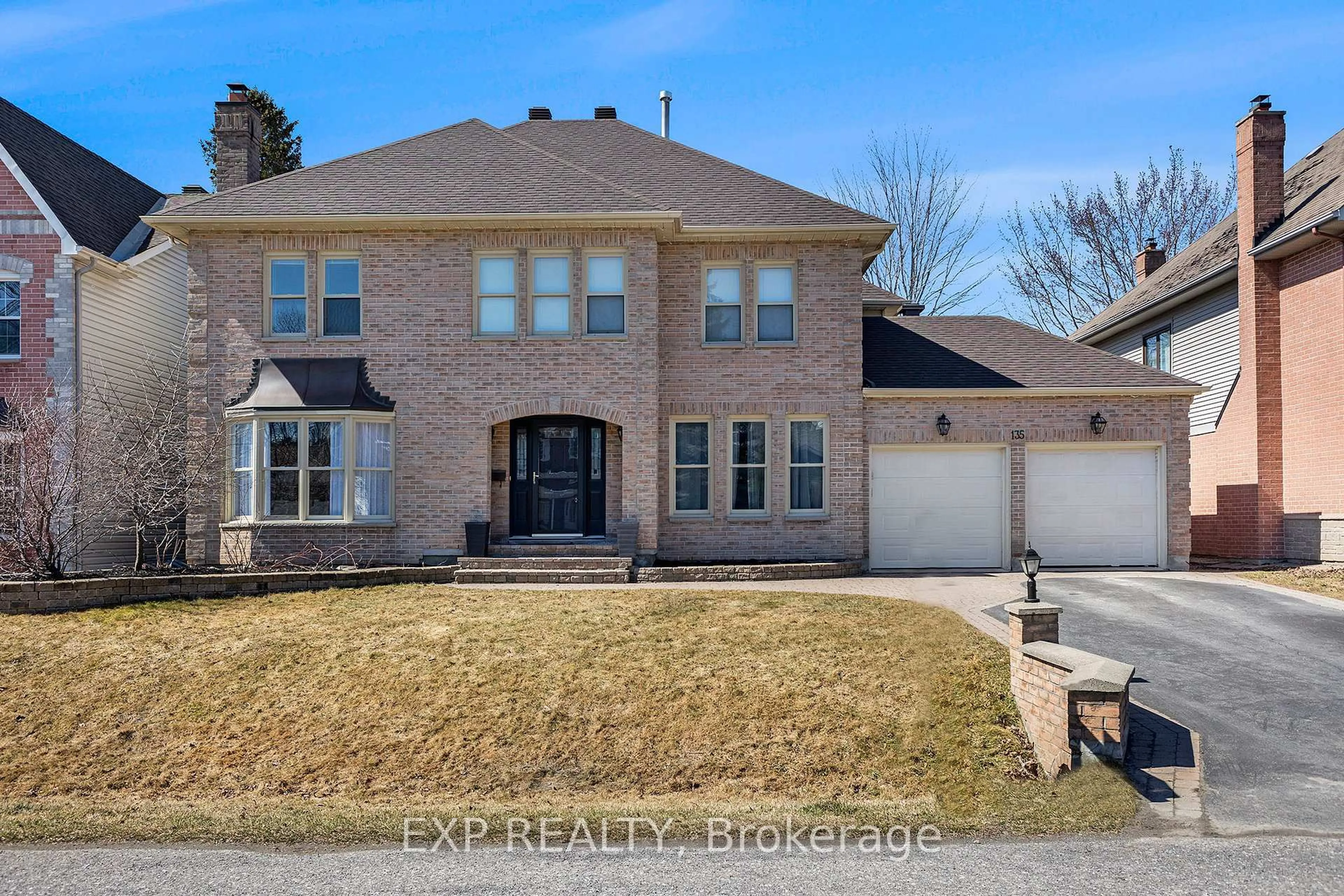 Home with brick exterior material, street for 135 Lanigan Cres, Stittsville Ontario K2S 1G9
