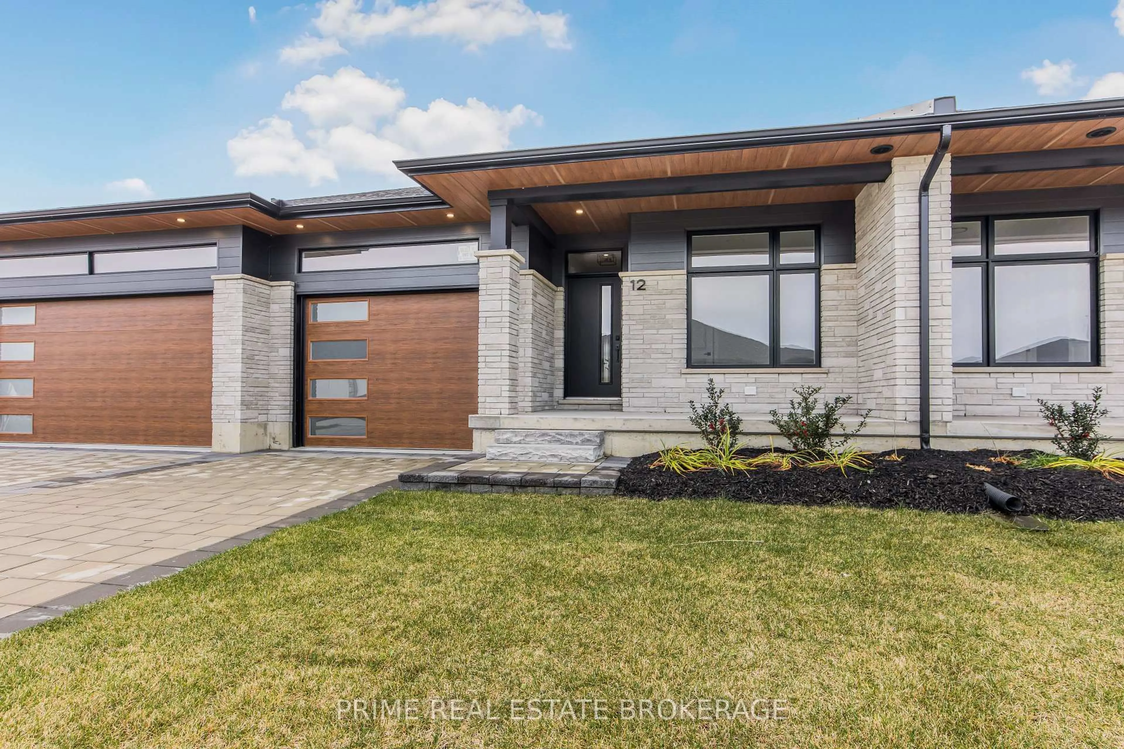 Home with brick exterior material, street for 12 Coastal Cres #50, Lambton Shores Ontario N0M 1T0