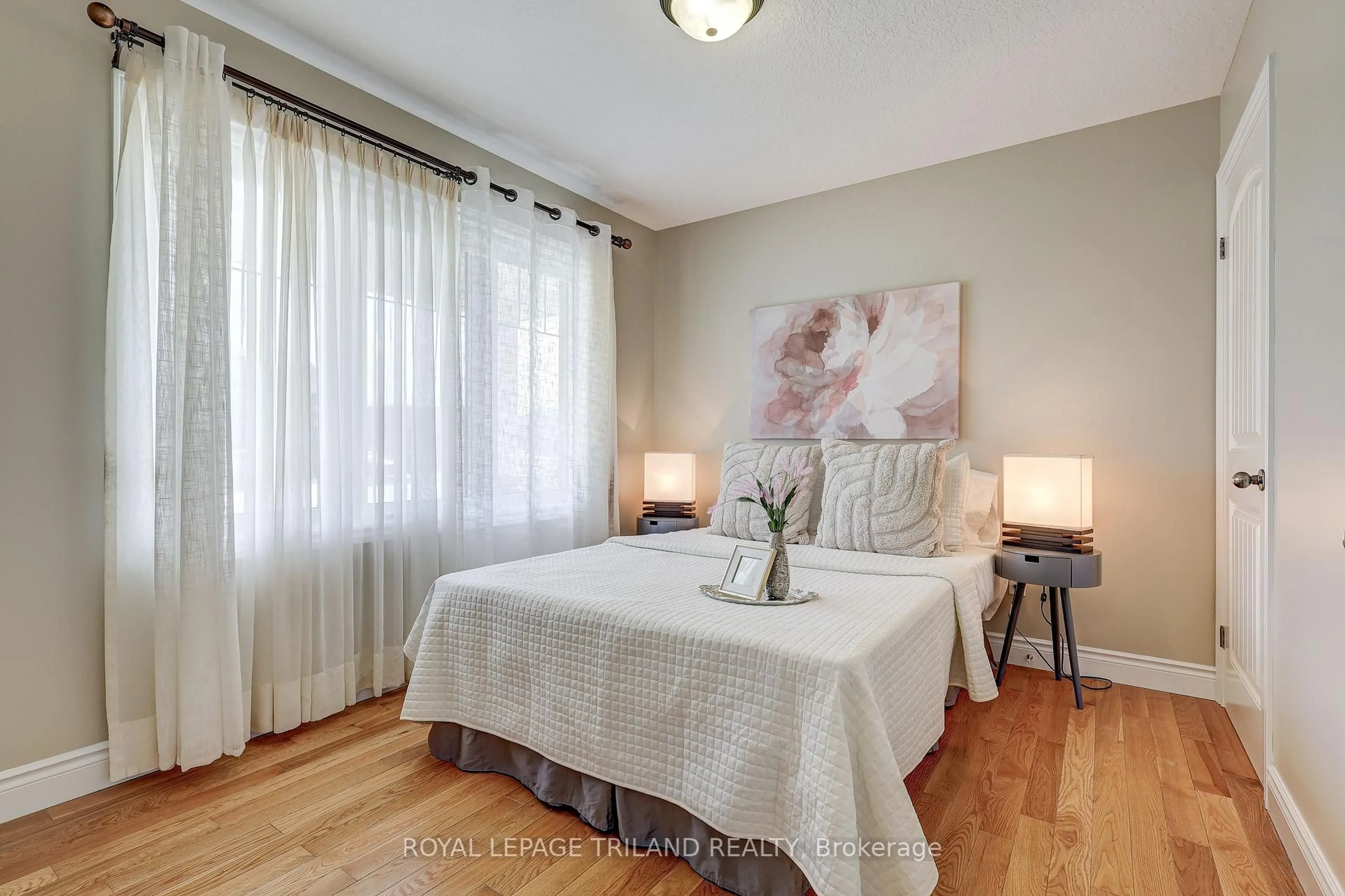 Bedroom with bed, wood/laminate floor for 48 AMBLESIDE Dr, St. Thomas Ontario N5P 4K3