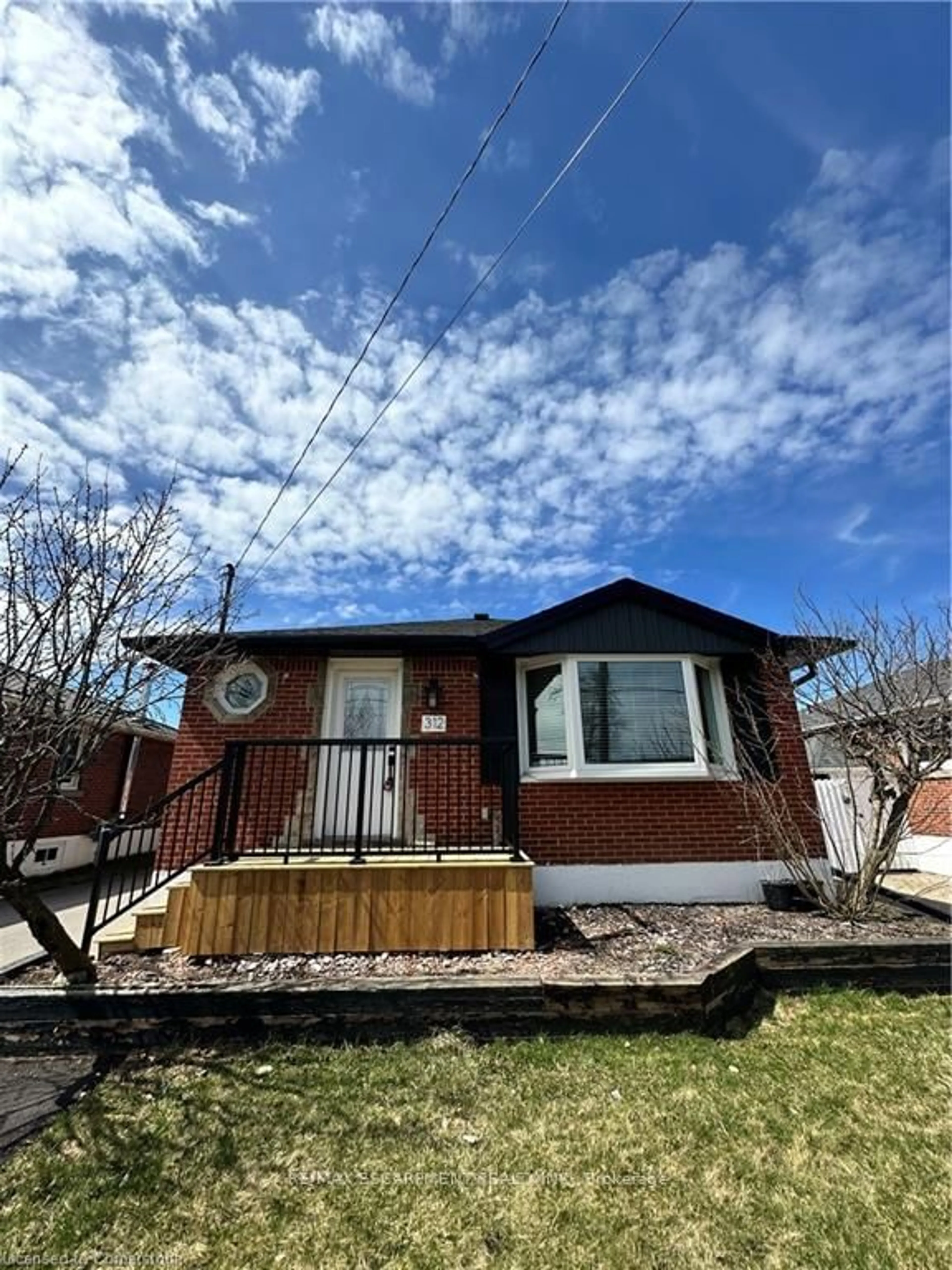 Home with vinyl exterior material, street for 312 East 45th St, Hamilton Ontario L8T 3K8