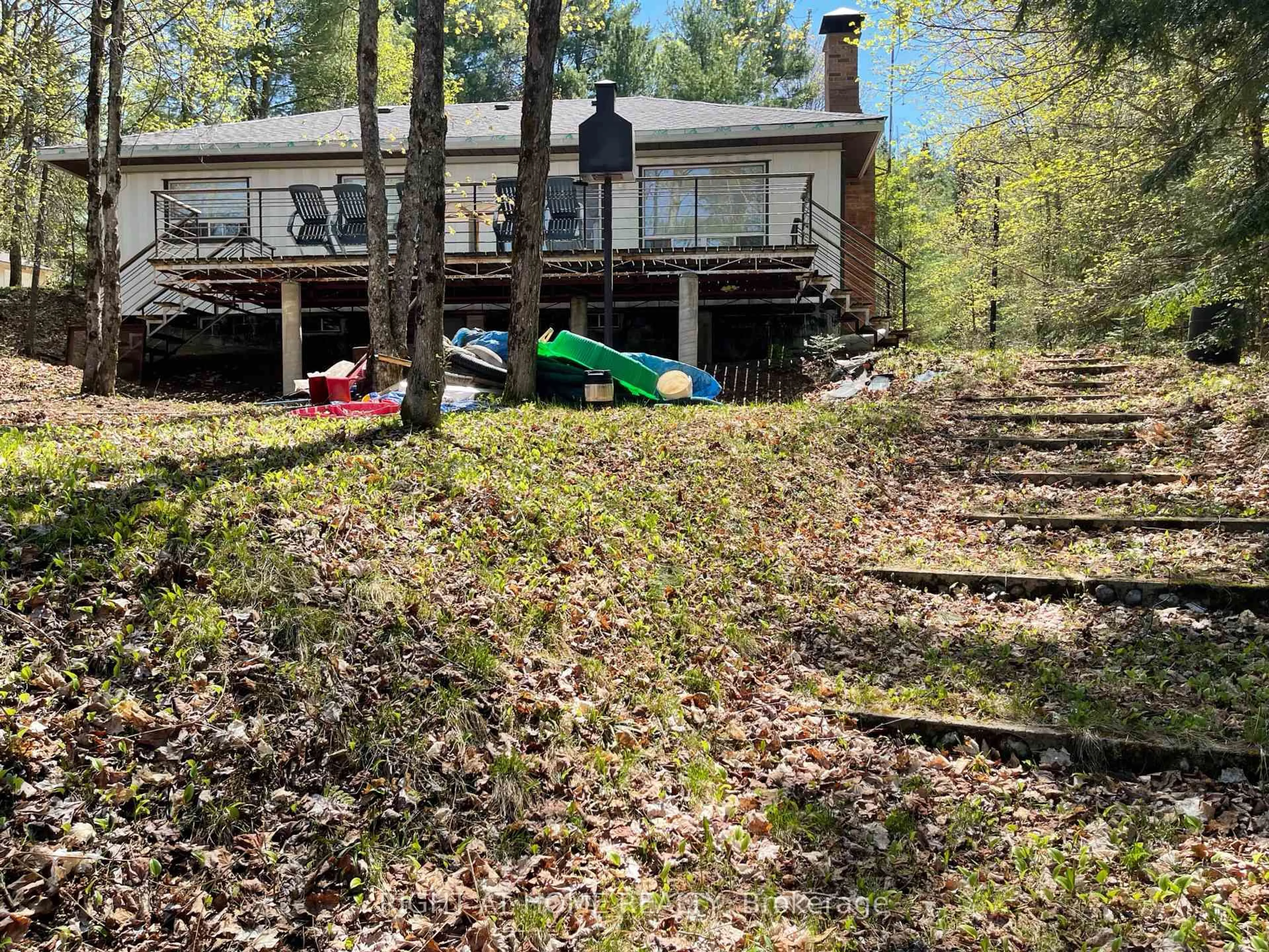 A pic from outside/outdoor area/front of a property/back of a property/a pic from drone, forest/trees view for 1114 River Haven Rd, Bracebridge Ontario P1L 1X1