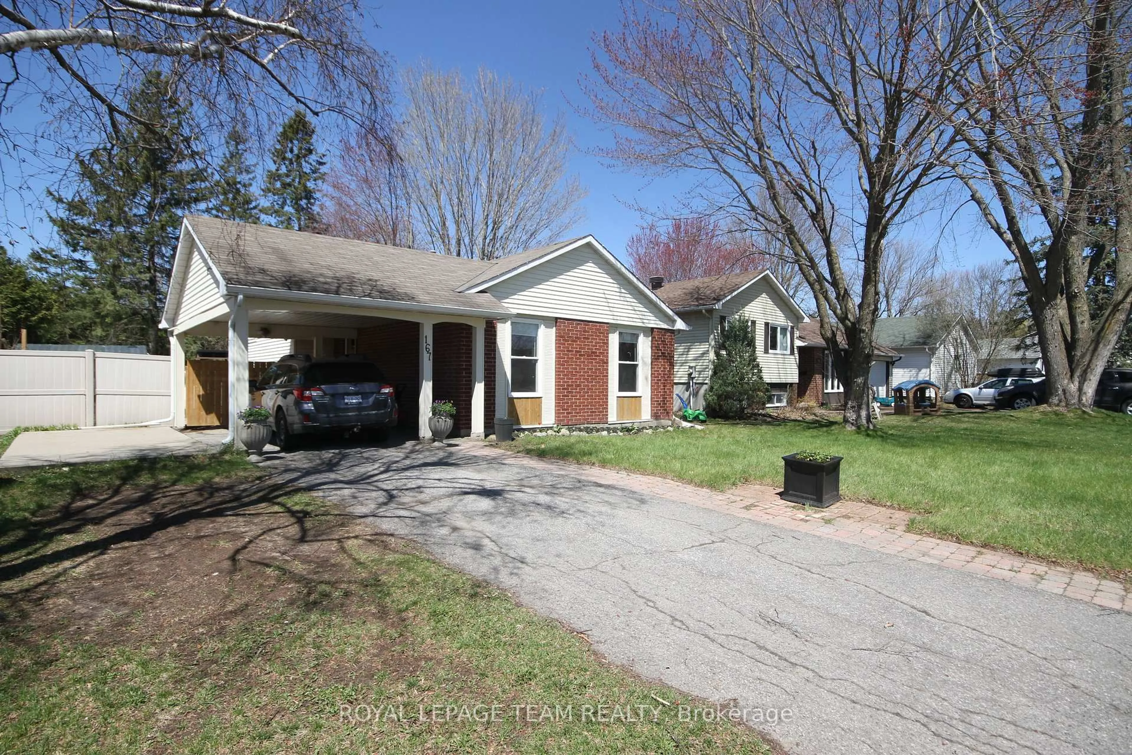Home with brick exterior material, street for 167 Abbeyhill Dr, Kanata Ontario K2L 2E9