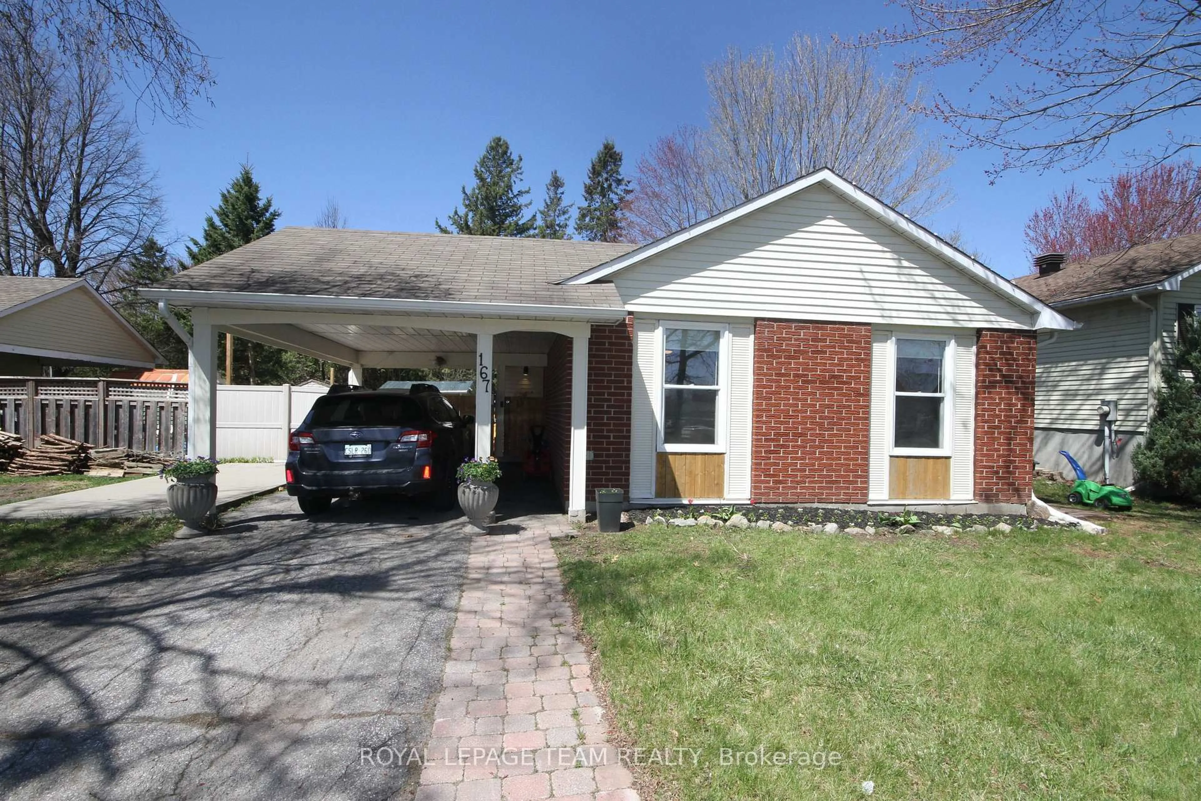 Home with brick exterior material, street for 167 Abbeyhill Dr, Kanata Ontario K2L 2E9