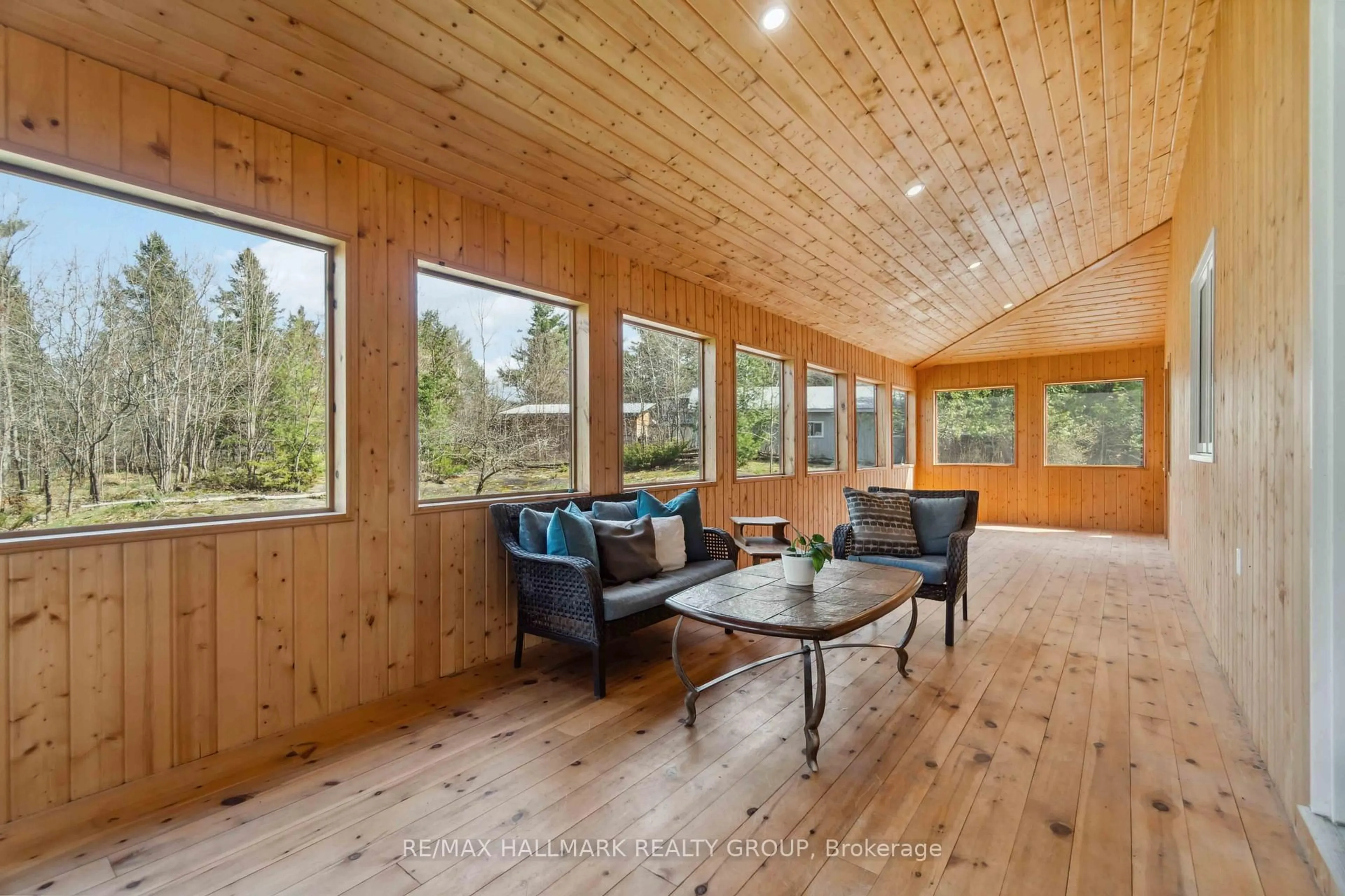 Living room with furniture, wood/laminate floor for 628 Sugar Bush Rd, Pakenham Ontario K0A 2X0