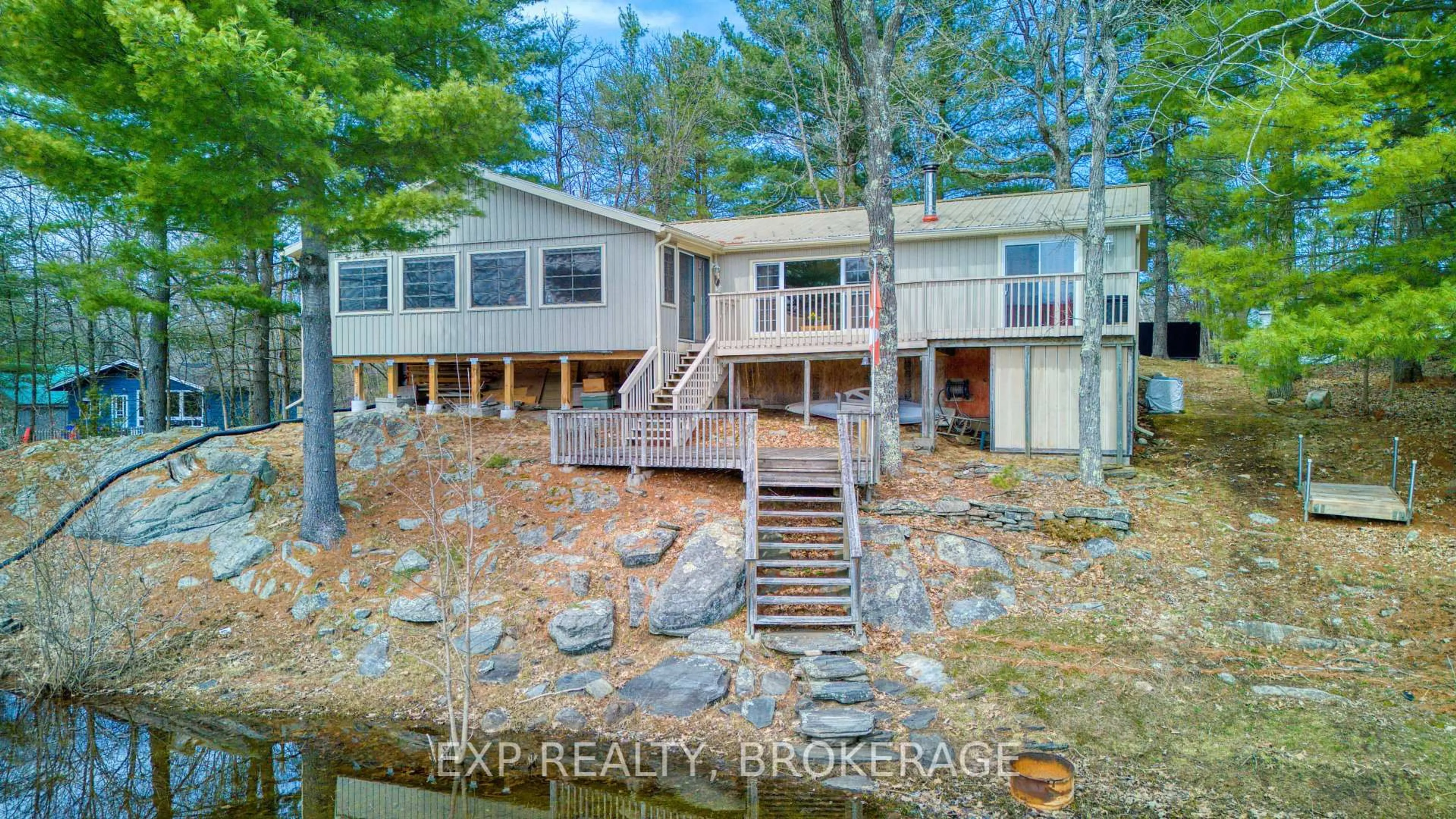 A pic from outside/outdoor area/front of a property/back of a property/a pic from drone, water/lake/river/ocean view for 1040 Turner Way, Arden Ontario K0H 1B0