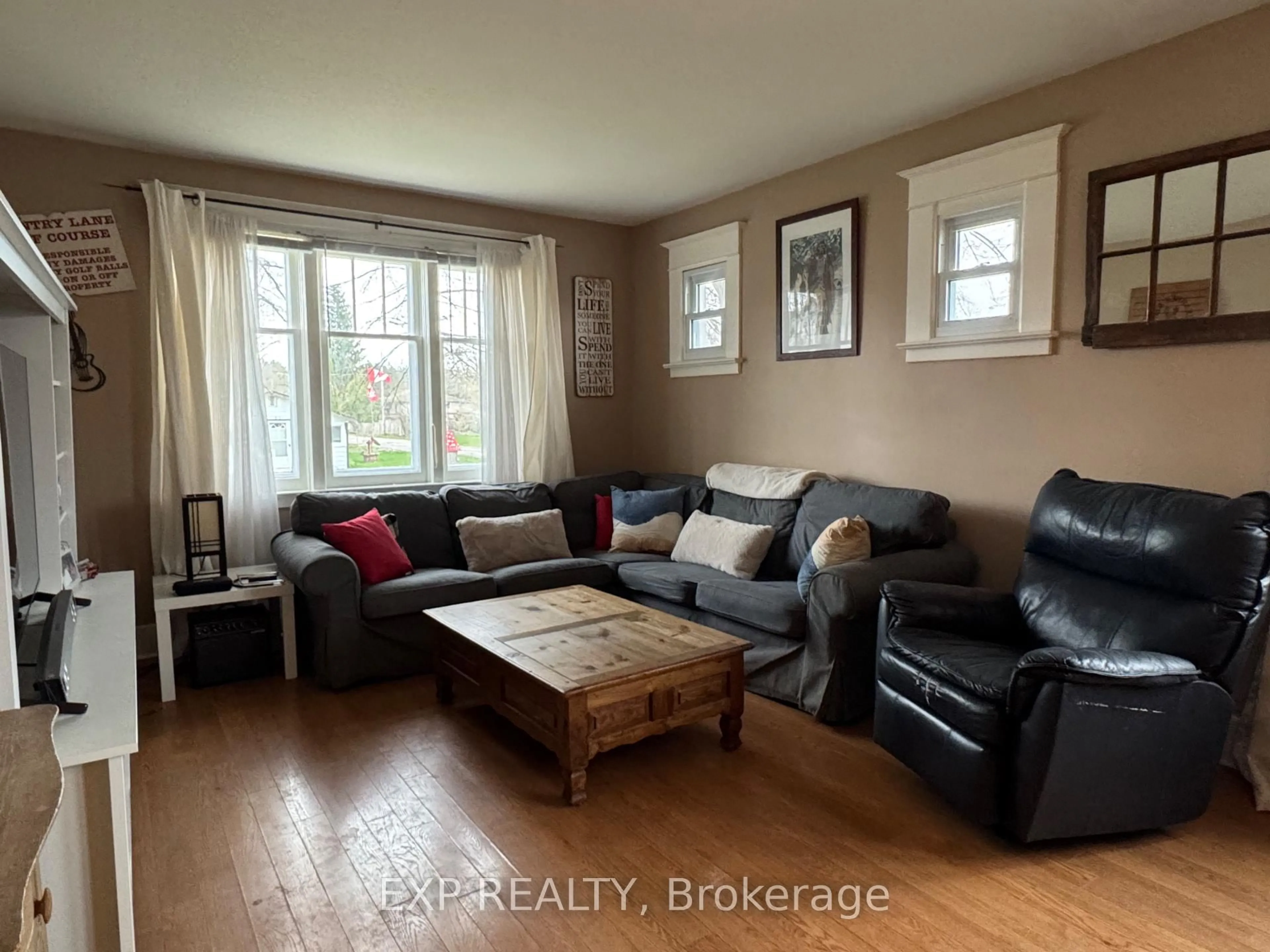 Living room with furniture, wood/laminate floor for 13 Queen St, Kawartha Lakes Ontario K0L 2W0