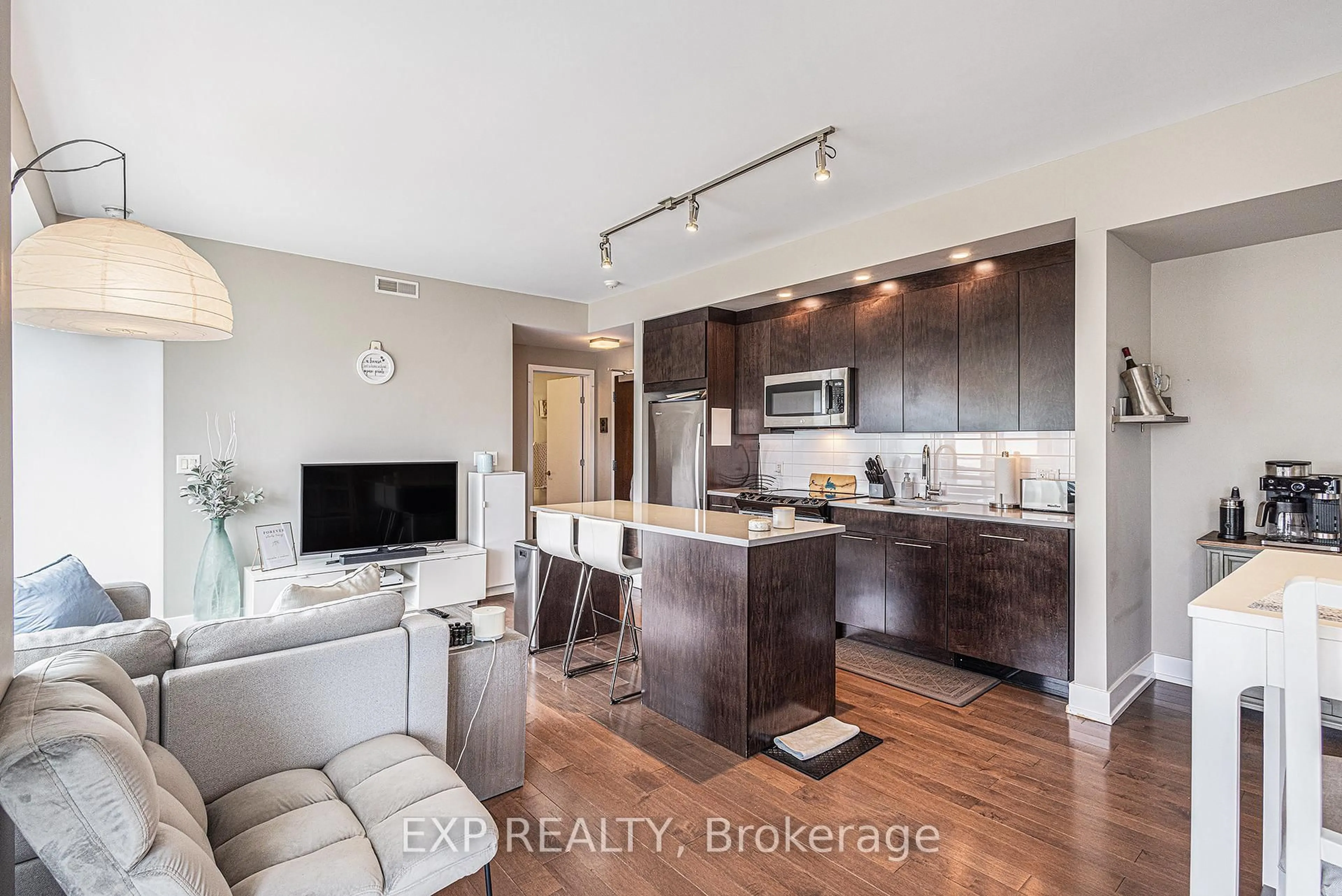 Open concept kitchen, wood/laminate floor for 360 Patricia Ave #814, Ottawa Ontario K1Z 0A8