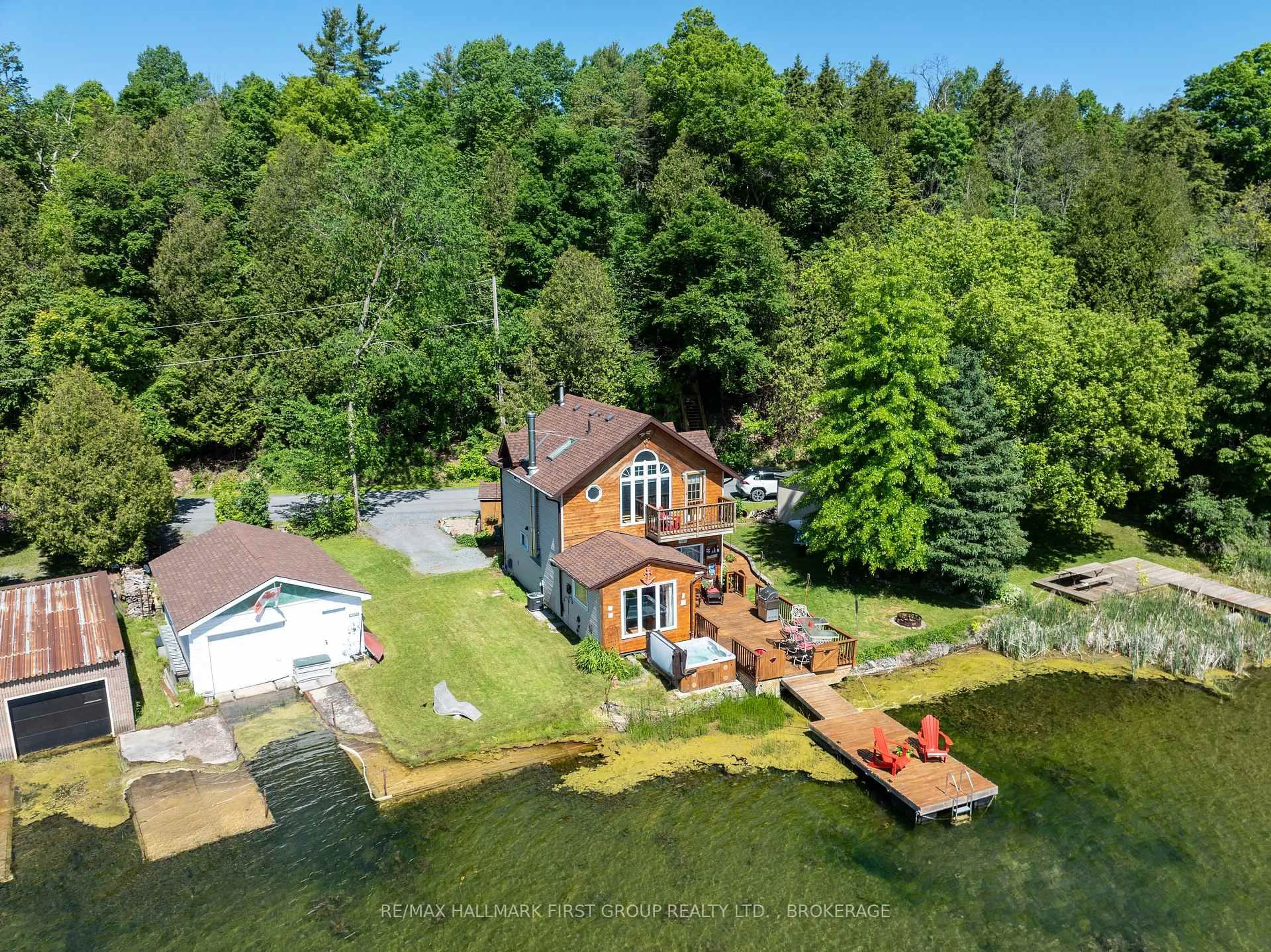 A pic from outside/outdoor area/front of a property/back of a property/a pic from drone, water/lake/river/ocean view for 3340 Loughborough Dr, Mcdonalds Corners Ontario K0H 1M0