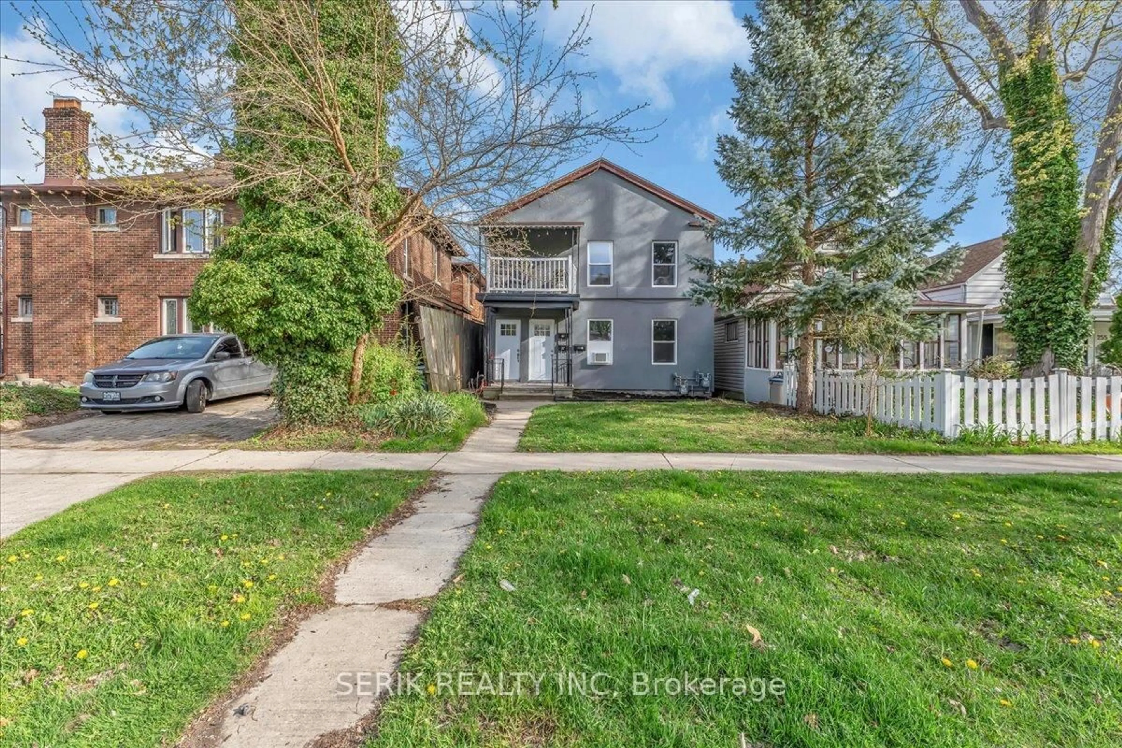 A pic from outside/outdoor area/front of a property/back of a property/a pic from drone, street for 231-233 Grove Ave, Windsor Ontario N9A 6E8