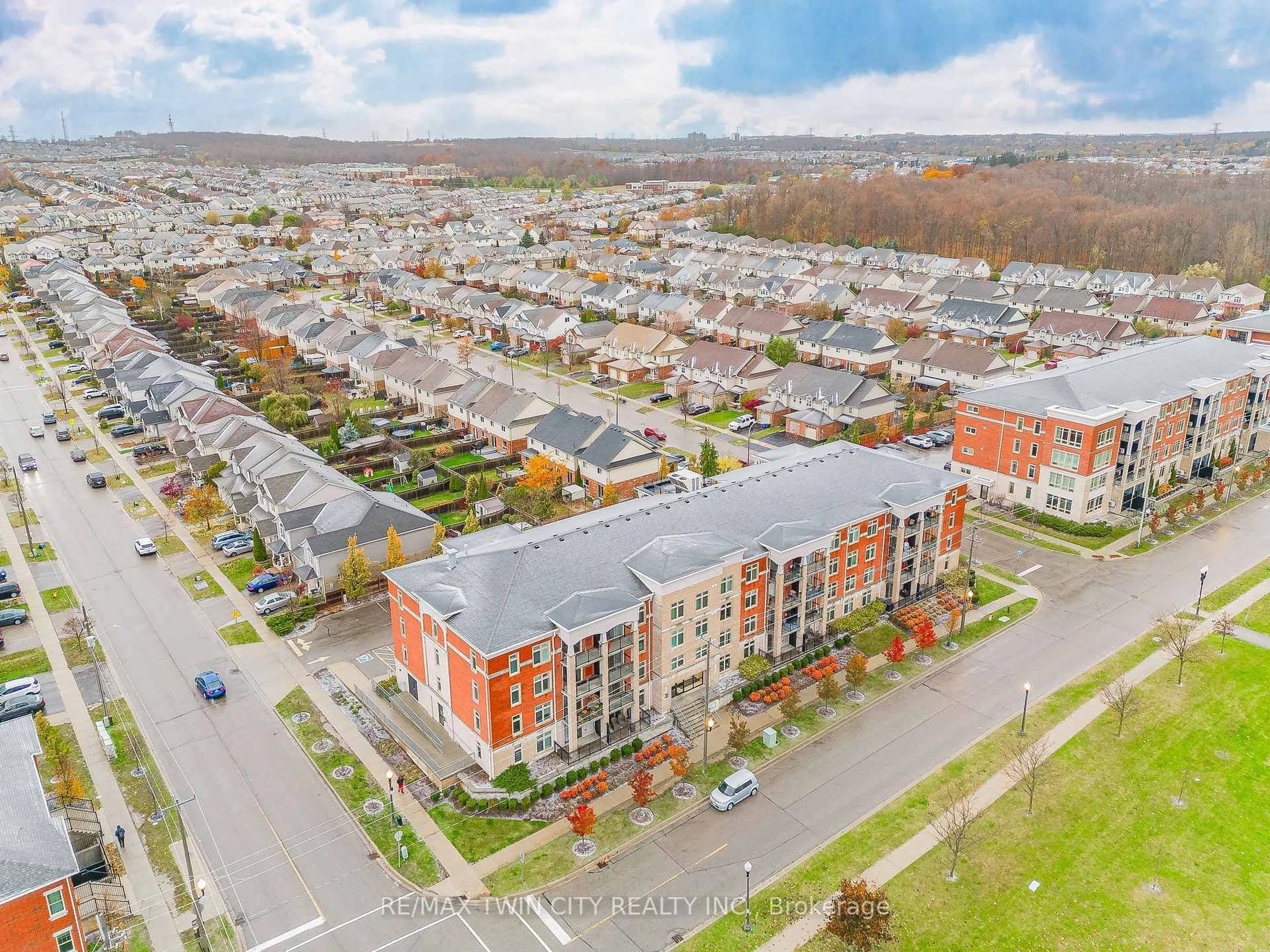 A pic from outside/outdoor area/front of a property/back of a property/a pic from drone, street for 155 Commonwealth St #410, Kitchener Ontario N2E 0G5