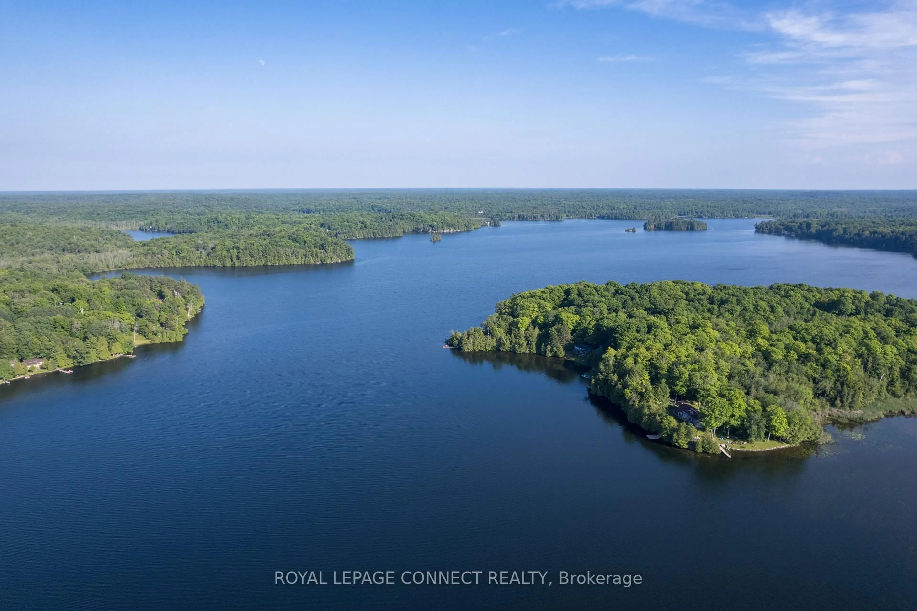 A pic from outside/outdoor area/front of a property/back of a property/a pic from drone, water/lake/river/ocean view for 1049 Johnston Rd, Arden Ontario K0H 1B0