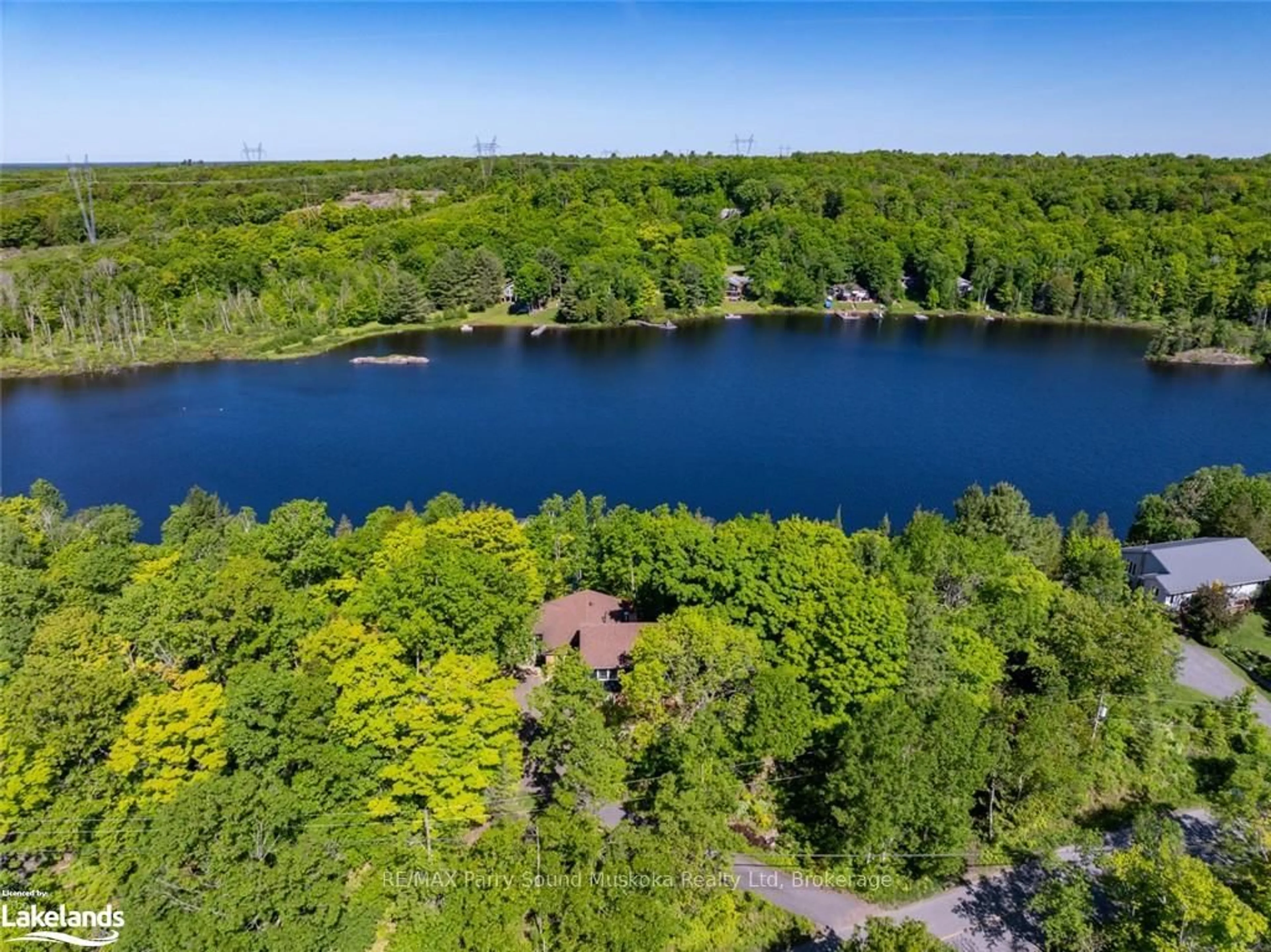 A pic from outside/outdoor area/front of a property/back of a property/a pic from drone, water/lake/river/ocean view for 68 Pinewood Rd, McDougall Ontario P2A 2W7