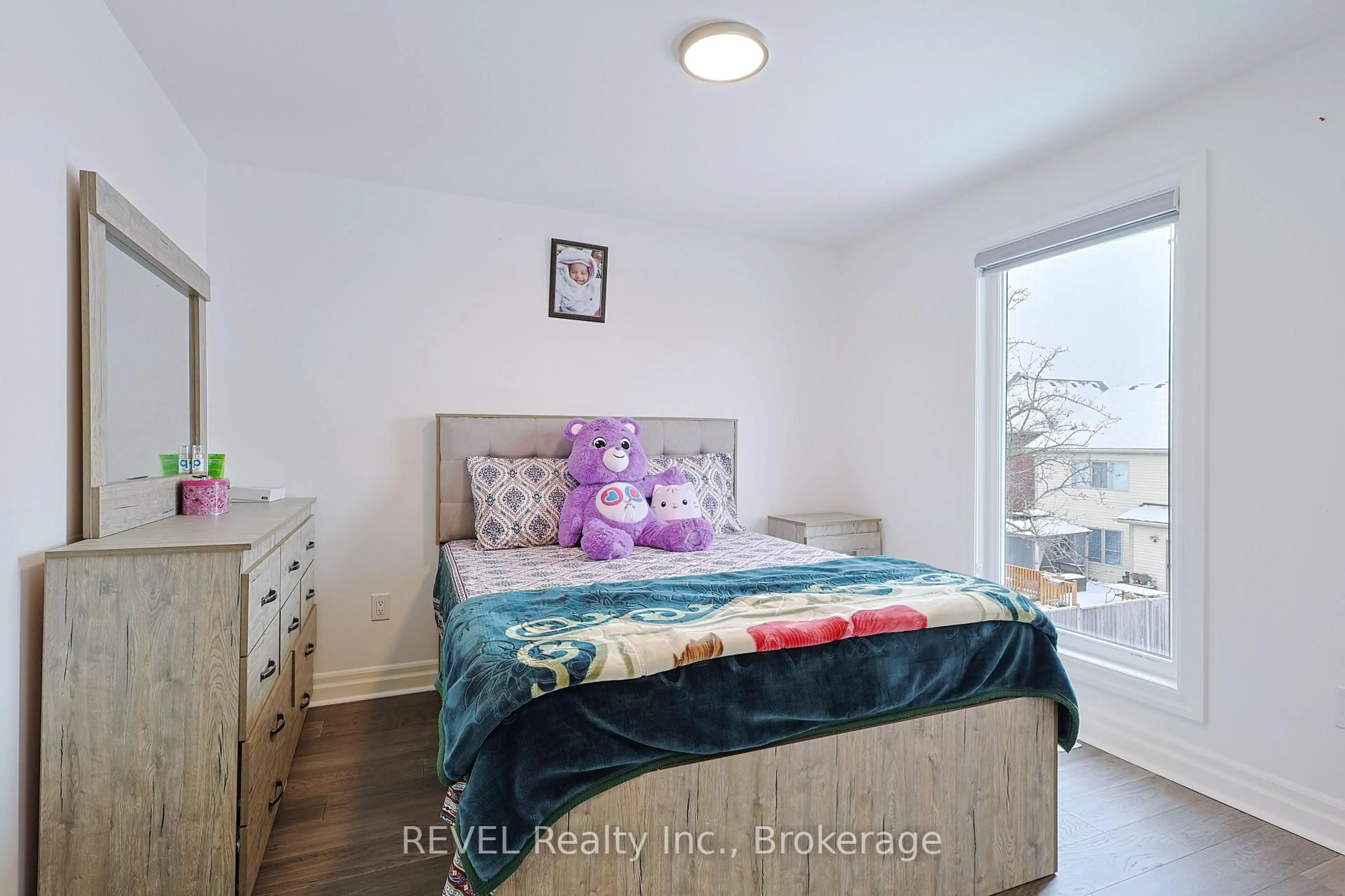 Bedroom with bed, wood/laminate floor for 7538 Splendour Dr, Niagara Falls Ontario L2H 3V9