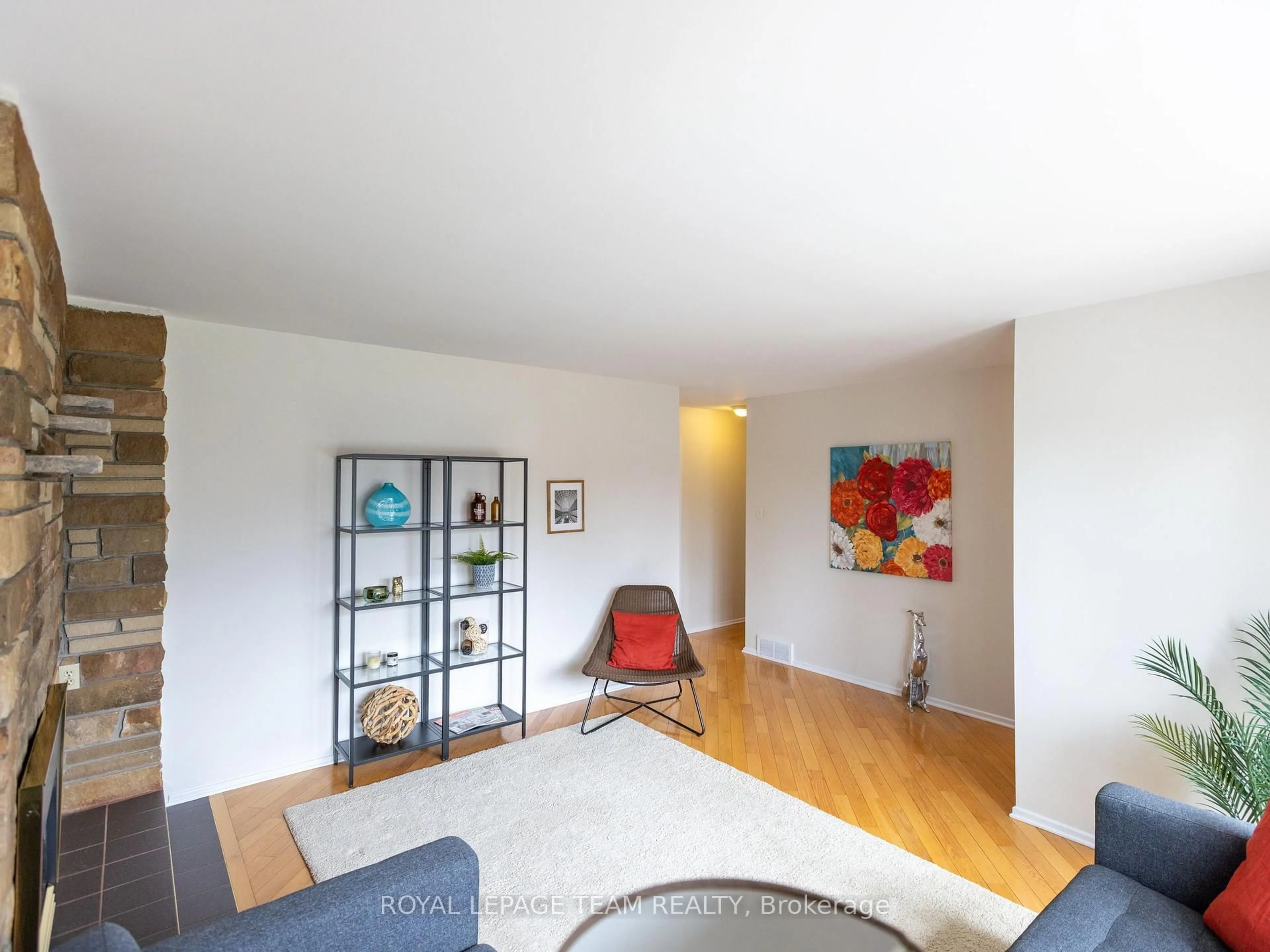 Living room with furniture, wood/laminate floor for 1357 Plumber Ave, Ottawa Ontario K1K 4B2