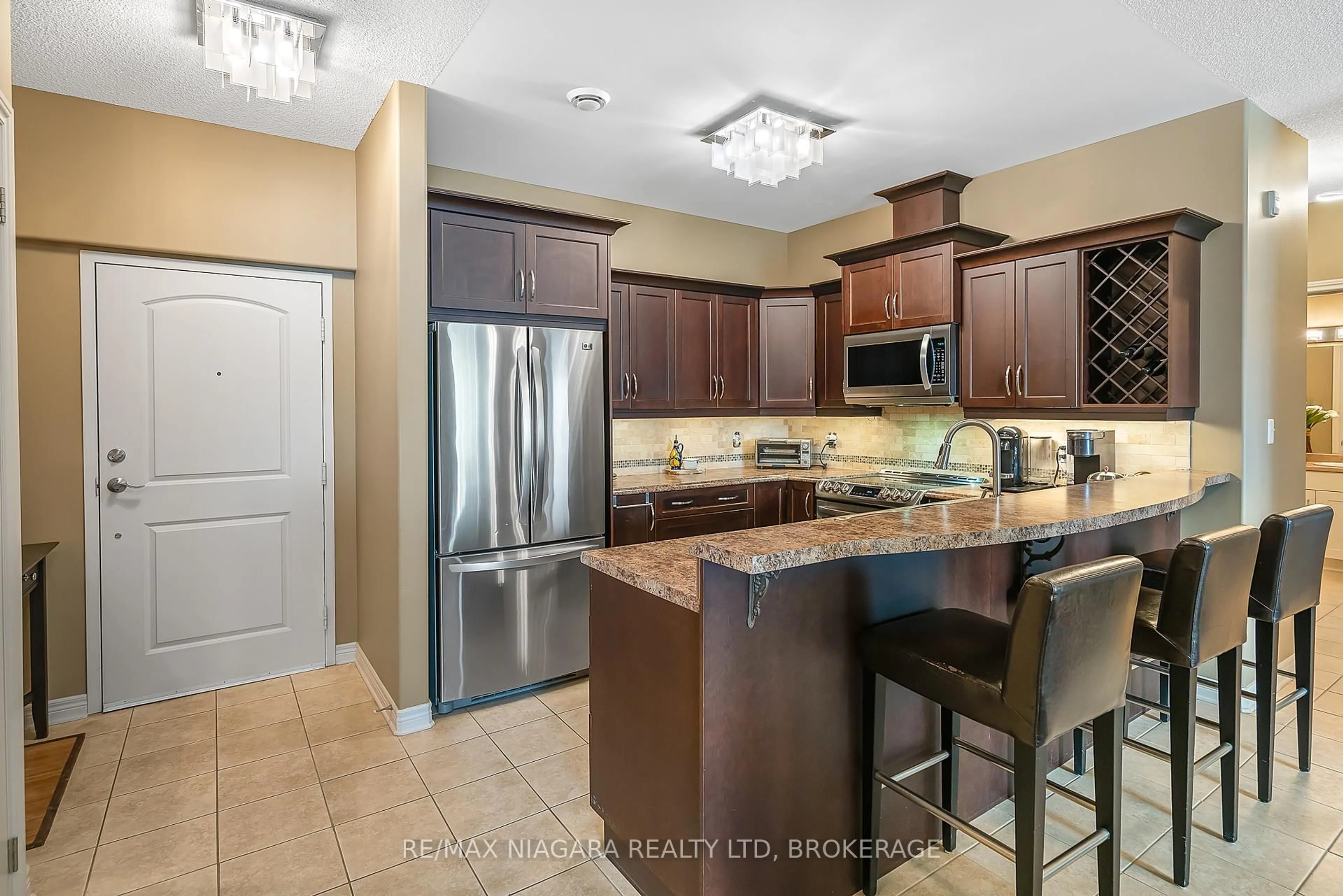 Open concept kitchen, ceramic/tile floor for 2799 St. Paul Ave #206, Niagara Falls Ontario L2J 2L3