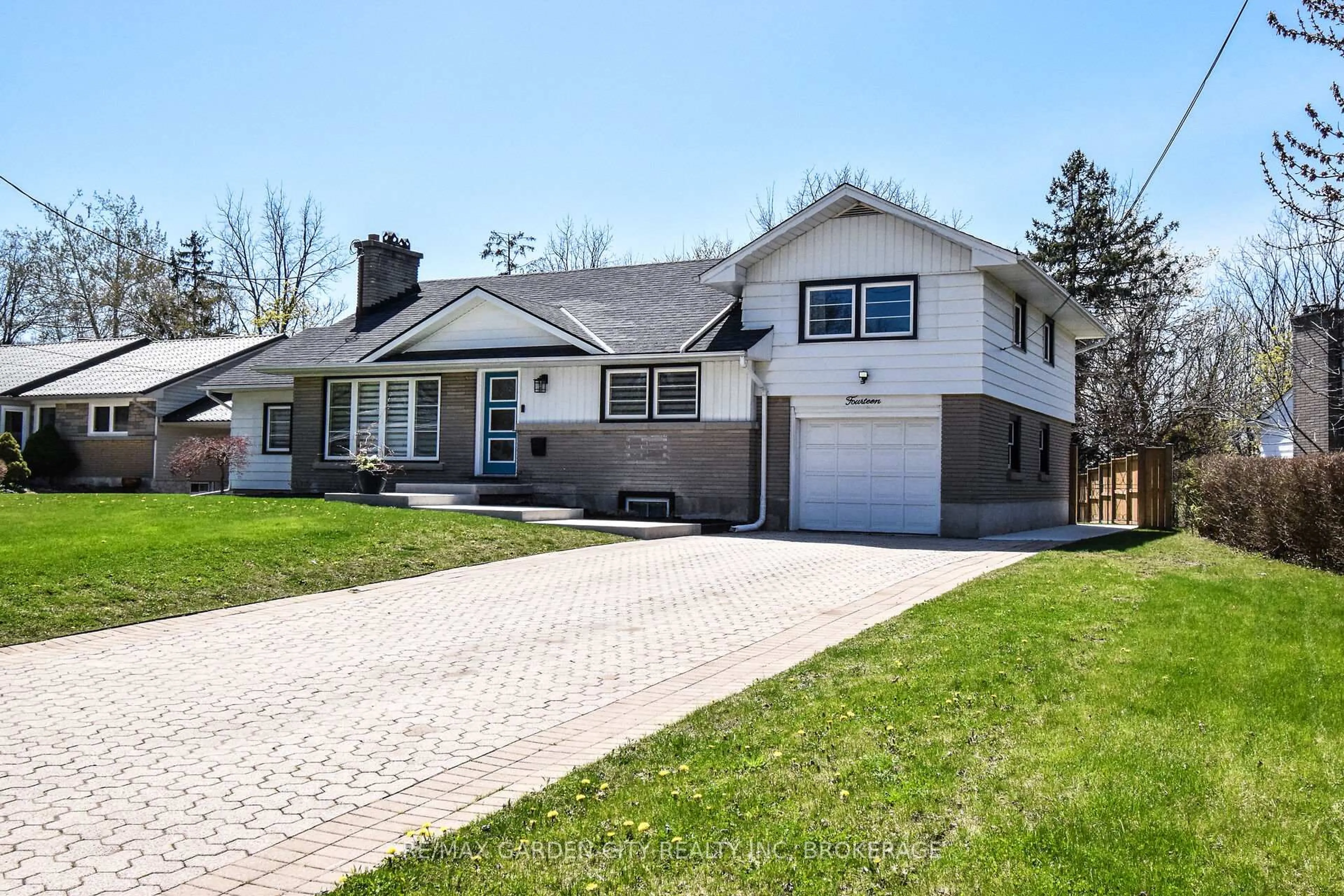 Home with brick exterior material, street for 14 Elmridge Dr, St. Catharines Ontario L2T 2A6