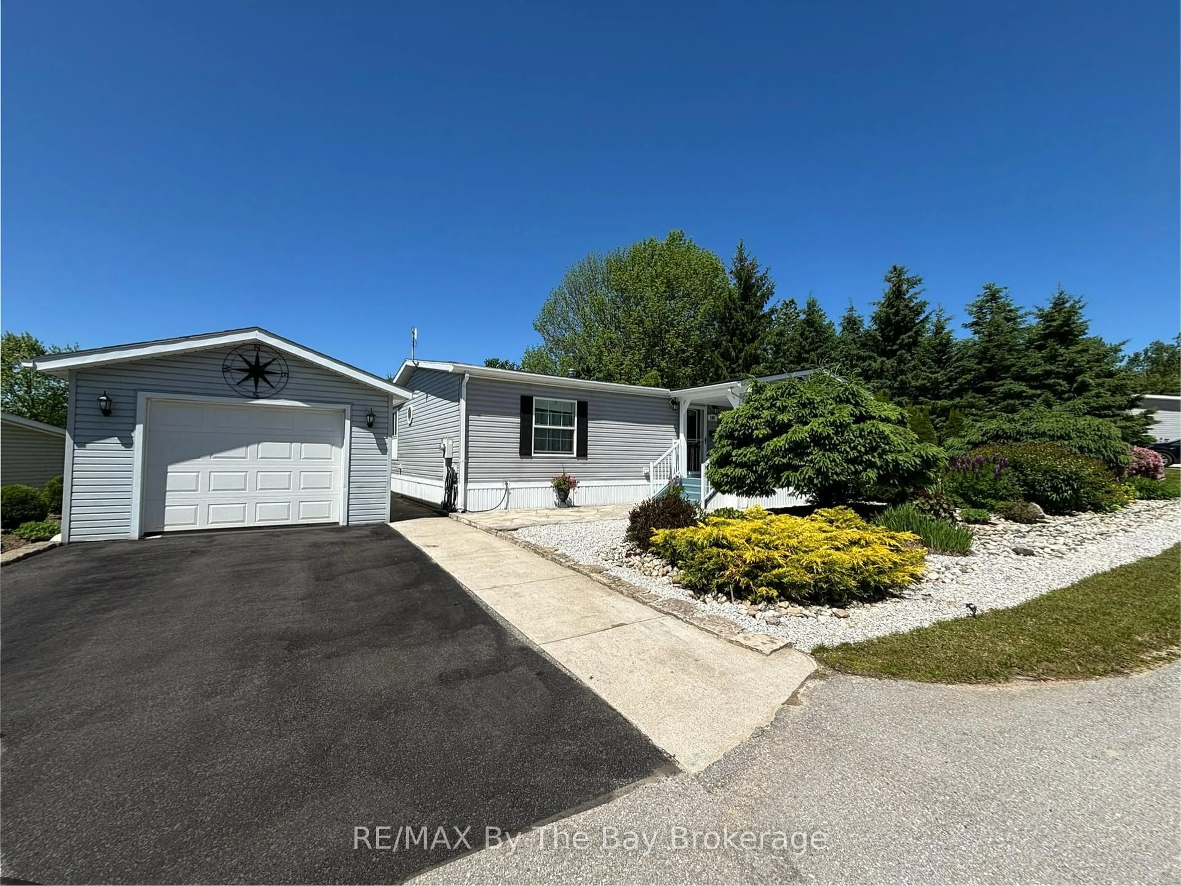 A pic from outside/outdoor area/front of a property/back of a property/a pic from drone, water/lake/river/ocean view for 102 Rosewood Dr, Georgian Bluffs Ontario N4K 5N5
