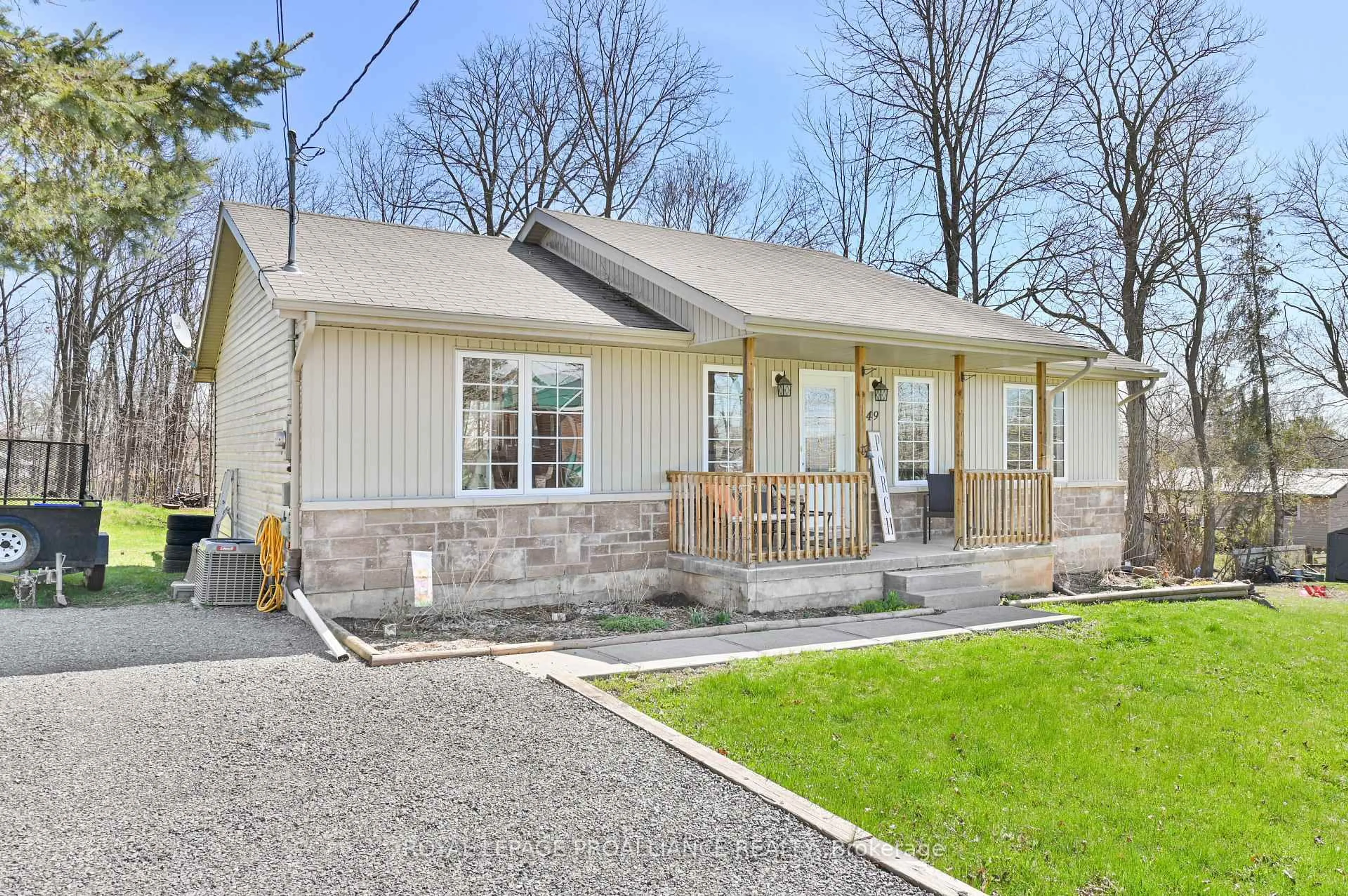 Home with vinyl exterior material, street for 49 Rollins St, Madoc Ontario K0K 2K0