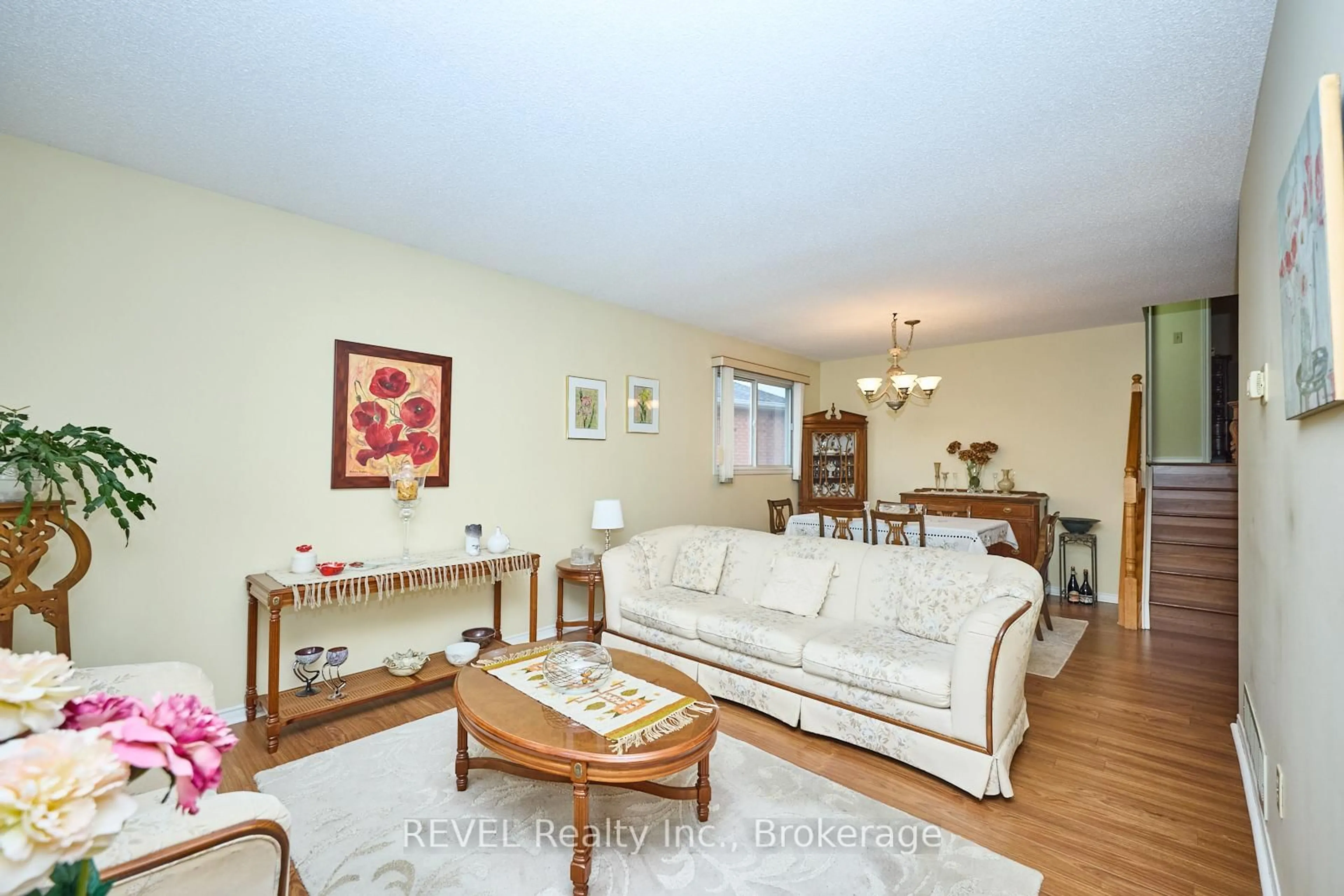 Living room with furniture, wood/laminate floor for 7395 Alex Ave, Niagara Falls Ontario L2G 7V1