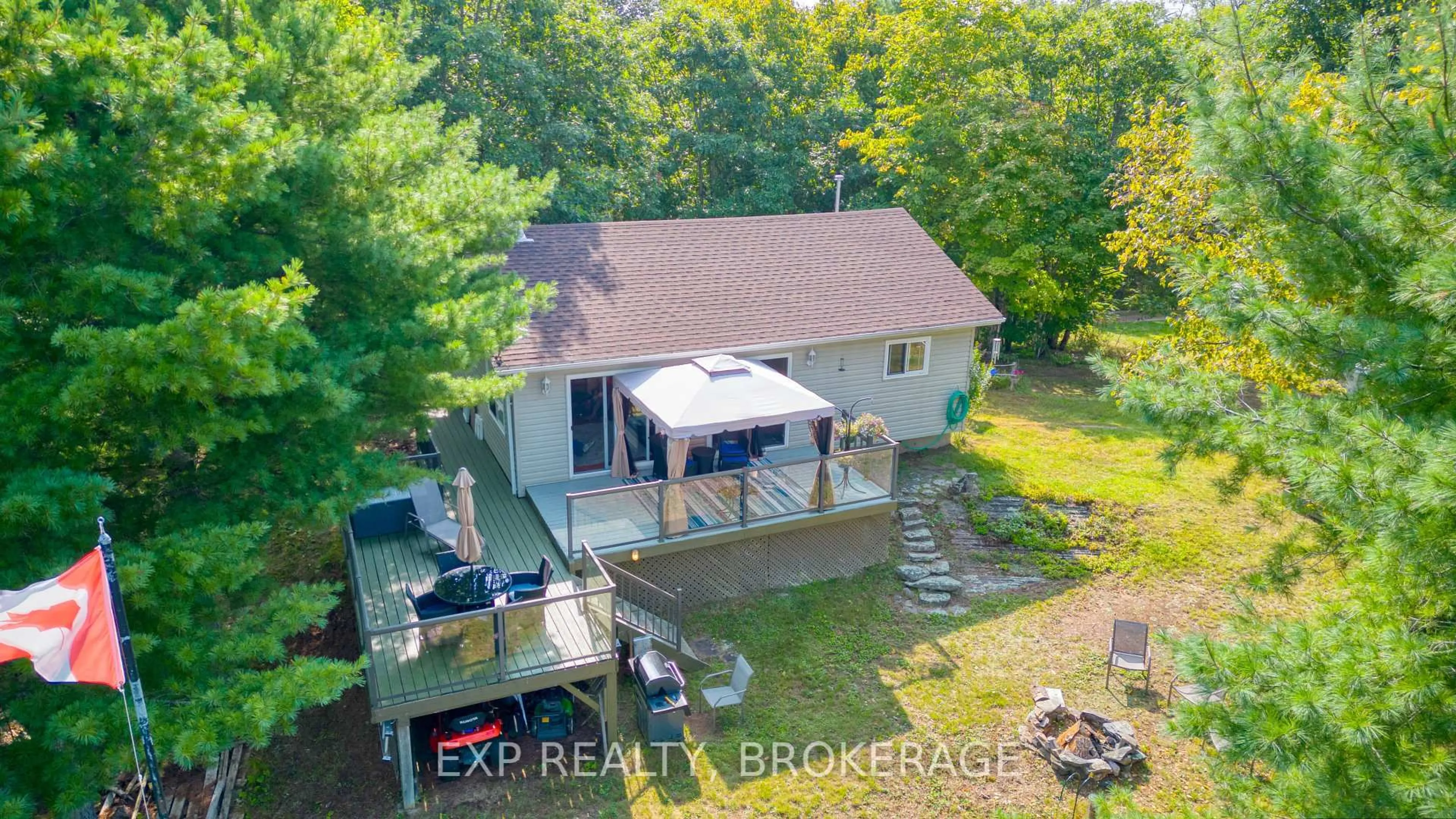 A pic from outside/outdoor area/front of a property/back of a property/a pic from drone, water/lake/river/ocean view for 1040 WATERS EDGE Lane, Arden Ontario K0H 1B0