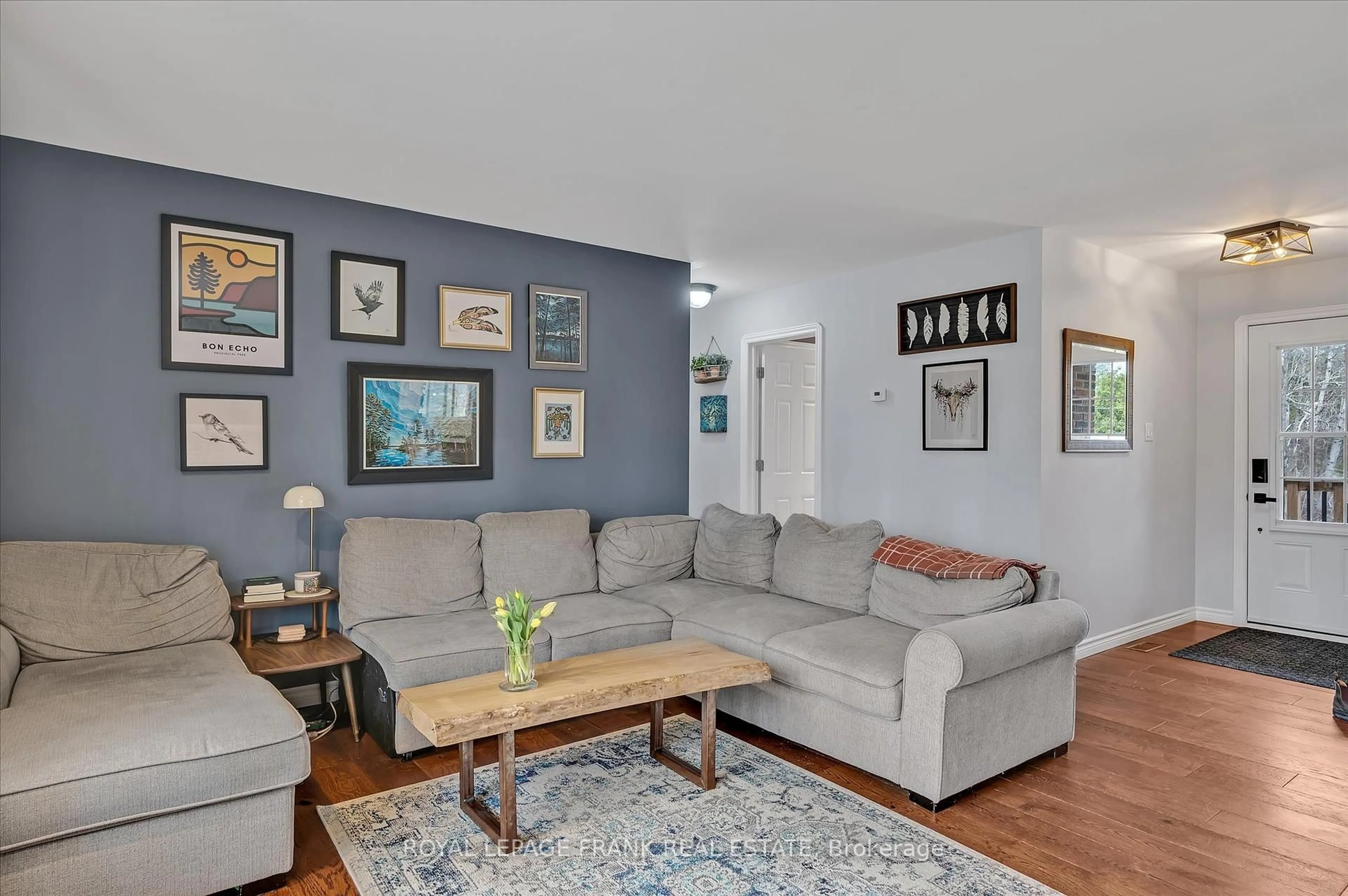 Living room with furniture, wood/laminate floor for 878 Payne Line Rd, Douro-Dummer Ontario K0L 3A0
