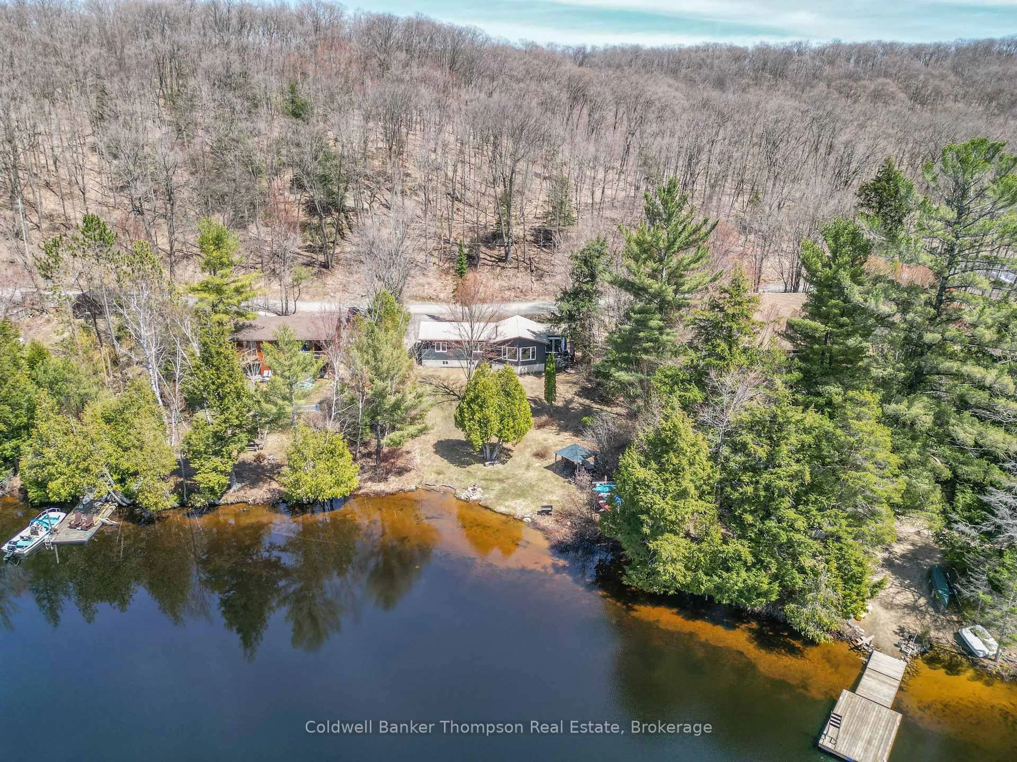 A pic from outside/outdoor area/front of a property/back of a property/a pic from drone, water/lake/river/ocean view for 810 East Waseosa Lake Rd, Huntsville Ontario P1H 2J4