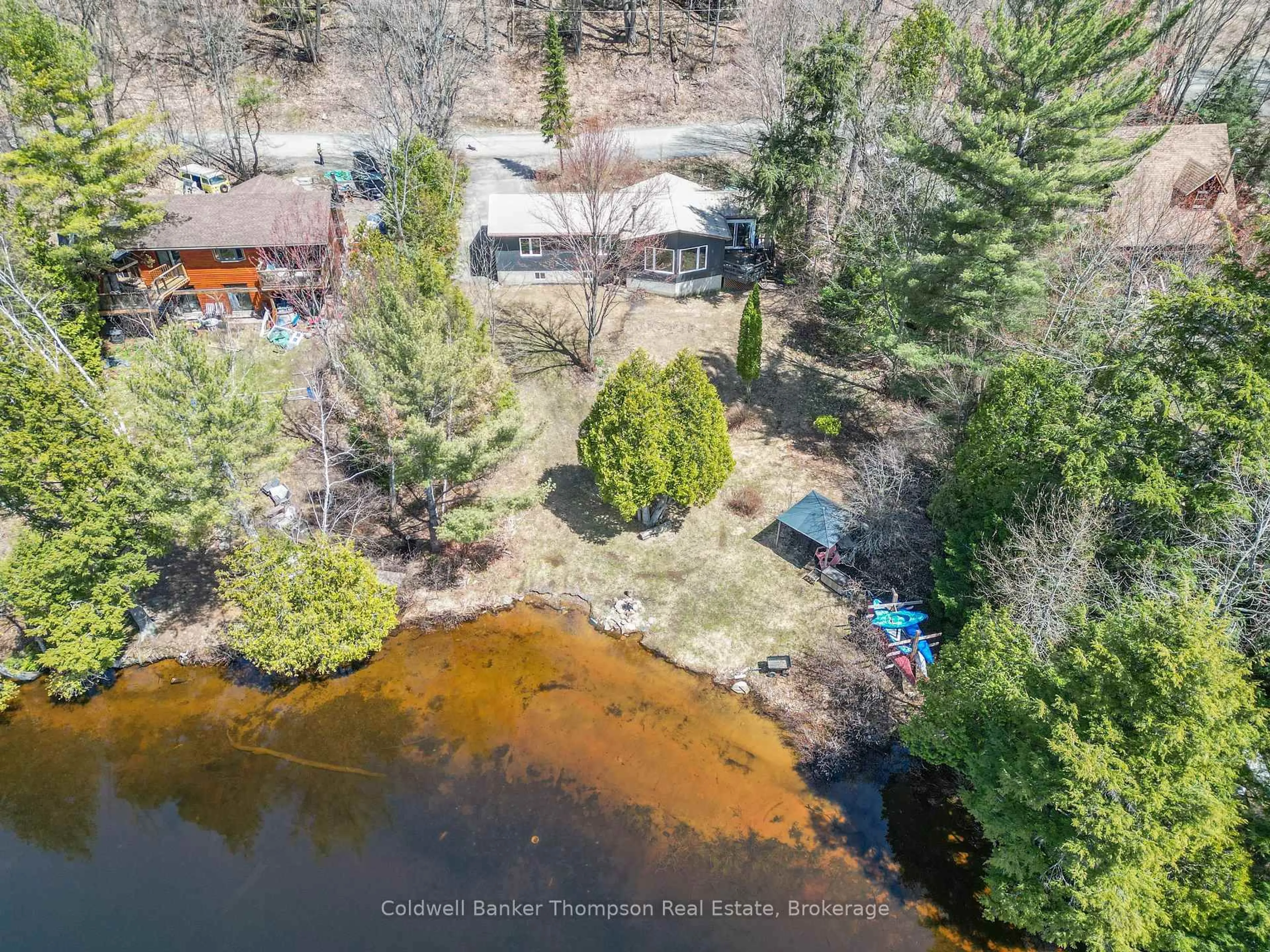 A pic from outside/outdoor area/front of a property/back of a property/a pic from drone, water/lake/river/ocean view for 810 East Waseosa Lake Rd, Huntsville Ontario P1H 2J4