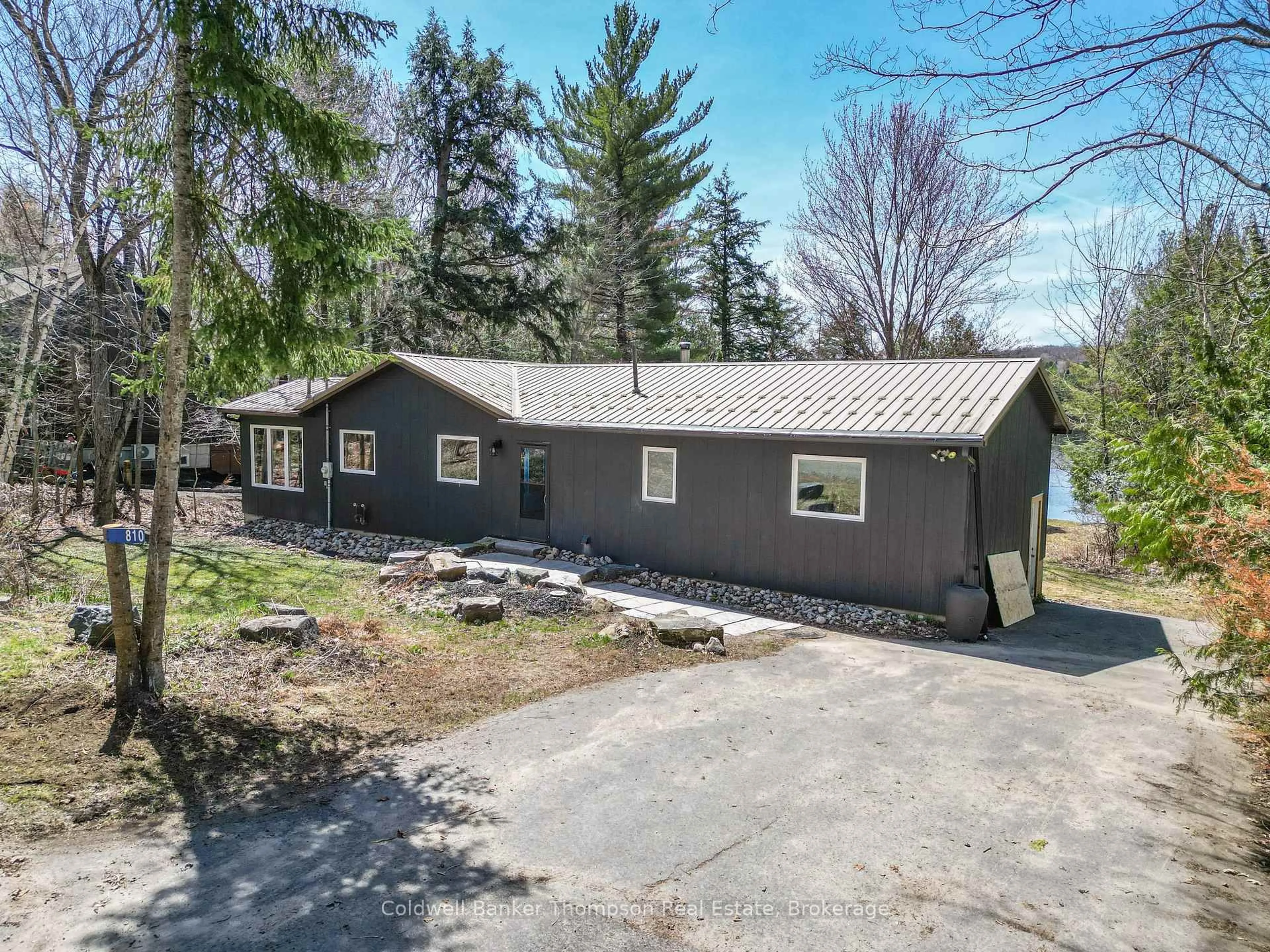 A pic from outside/outdoor area/front of a property/back of a property/a pic from drone, water/lake/river/ocean view for 810 East Waseosa Lake Rd, Huntsville Ontario P1H 2J4