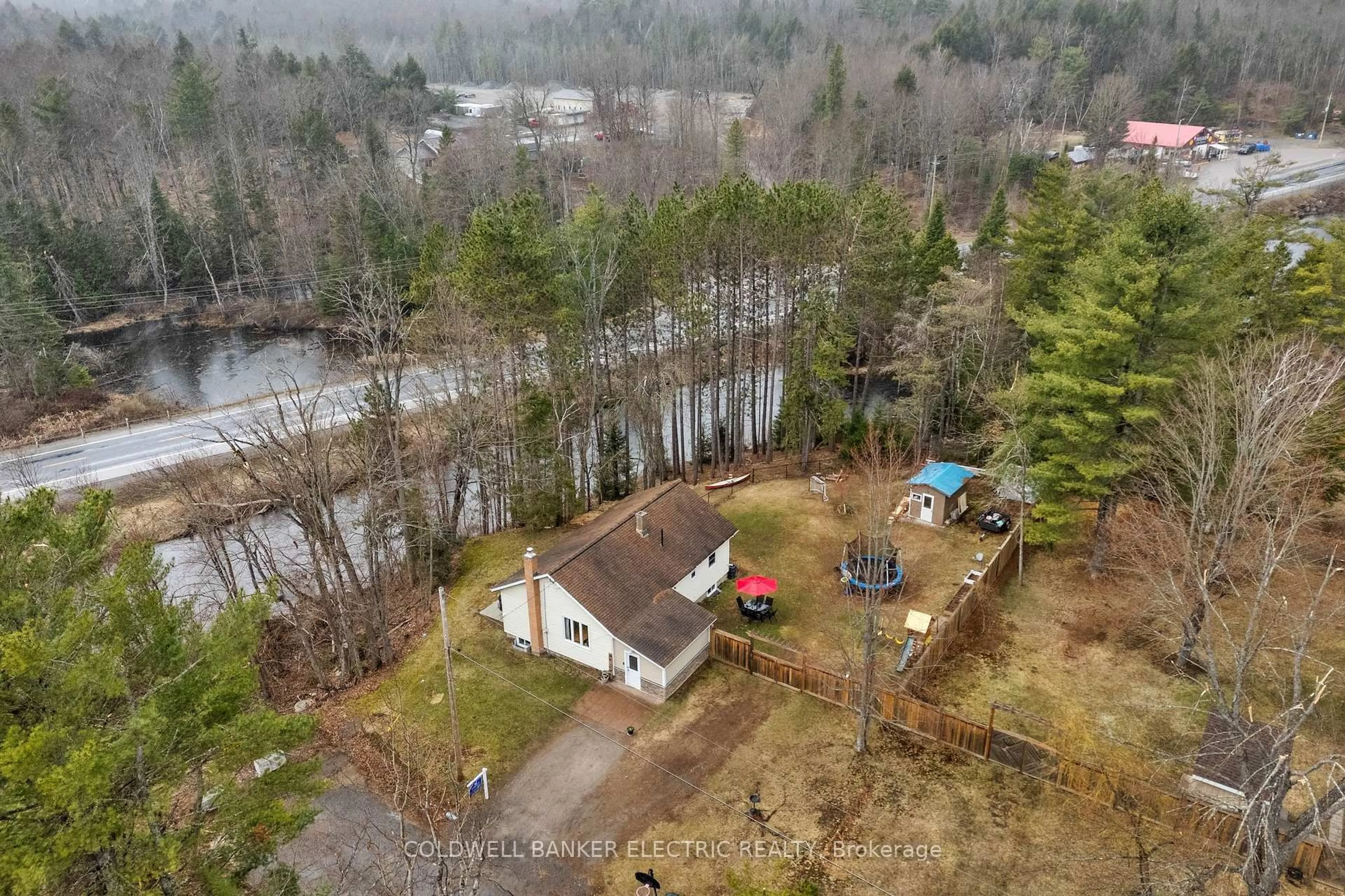 A pic from outside/outdoor area/front of a property/back of a property/a pic from drone, water/lake/river/ocean view for 58 River St, North Kawartha Ontario K0L 1A0