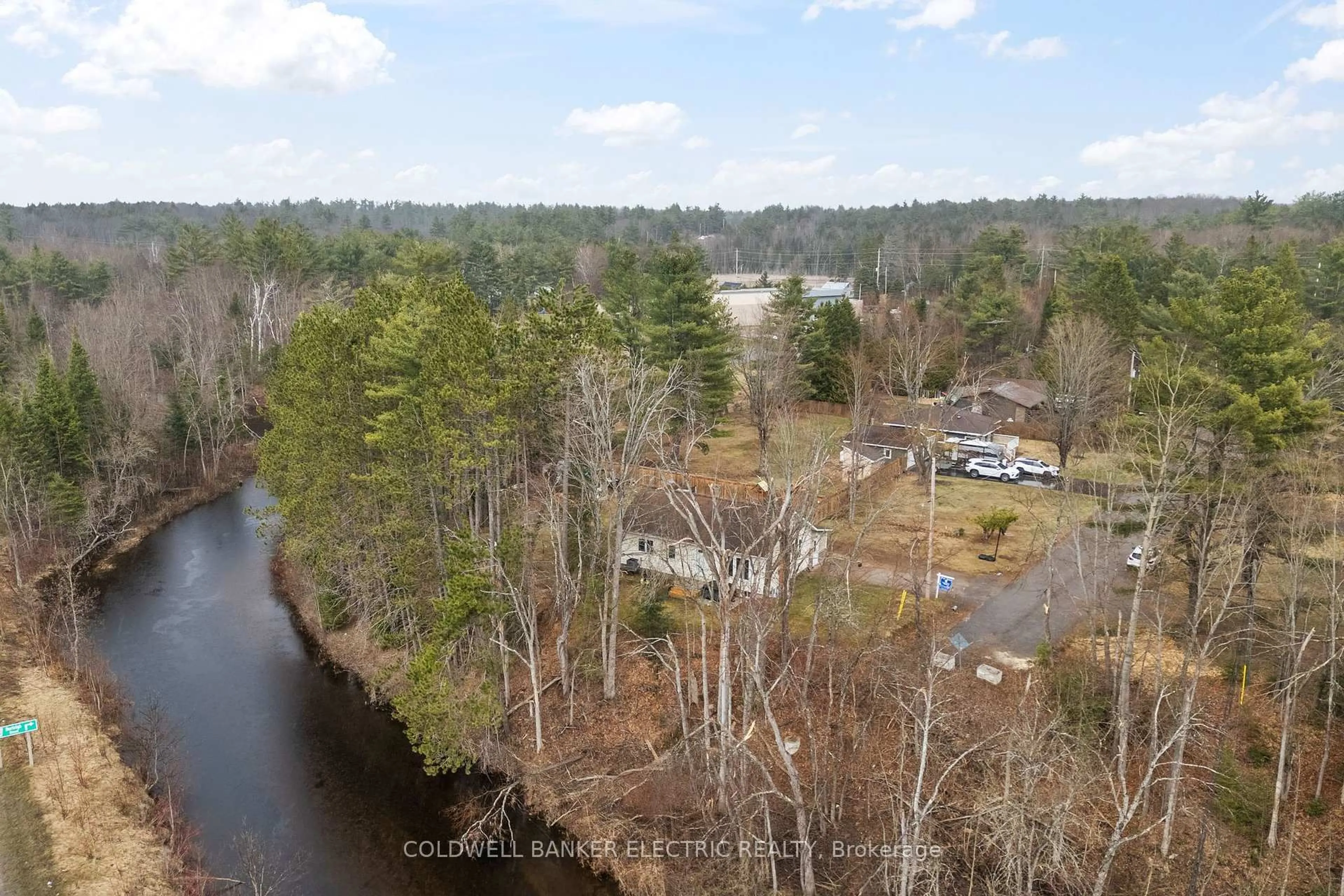 A pic from outside/outdoor area/front of a property/back of a property/a pic from drone, water/lake/river/ocean view for 58 River St, North Kawartha Ontario K0L 1A0
