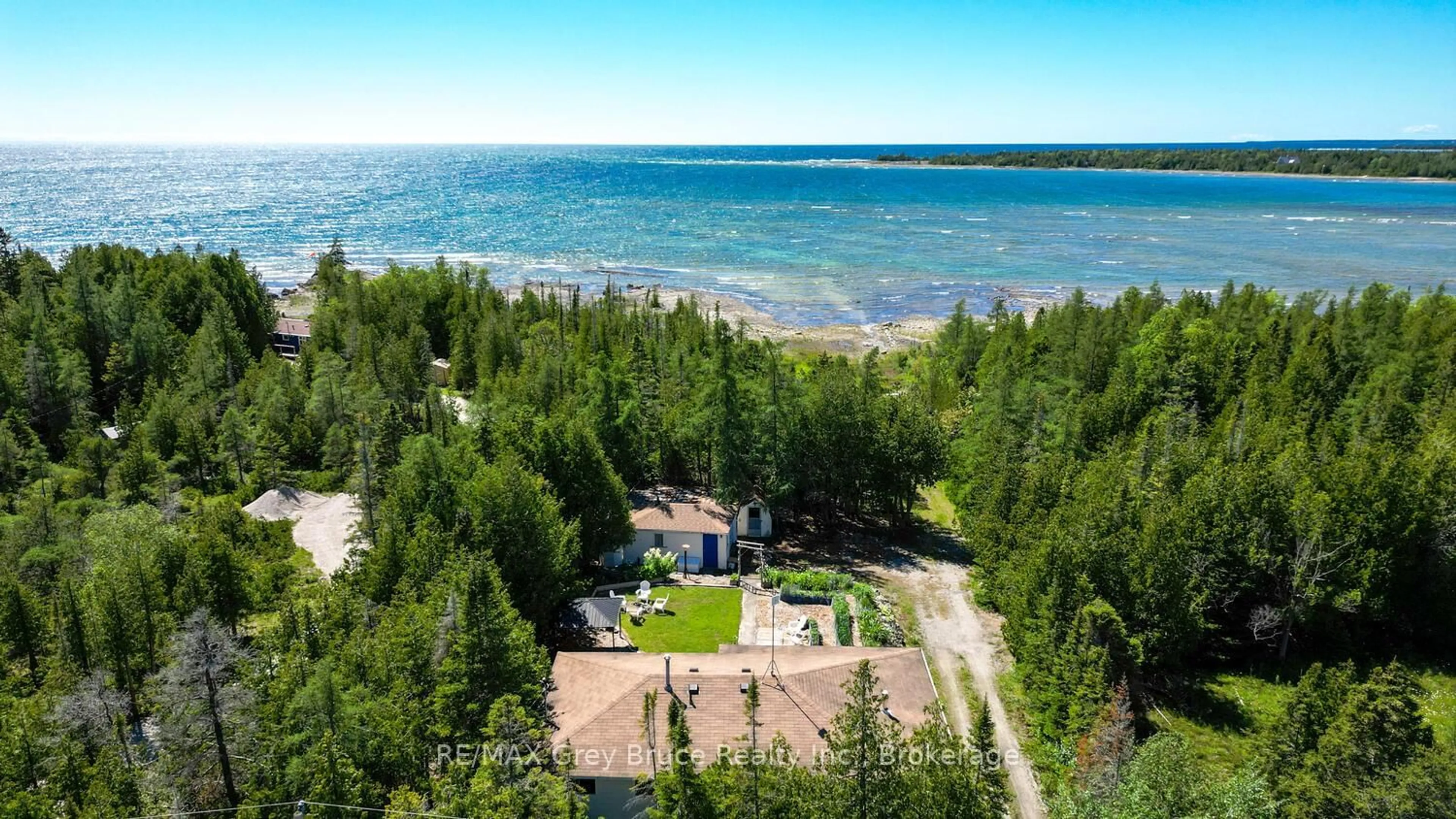 A pic from outside/outdoor area/front of a property/back of a property/a pic from drone, water/lake/river/ocean view for 1034 DORCAS BAY Rd, Northern Bruce Peninsula Ontario N0H 2R0