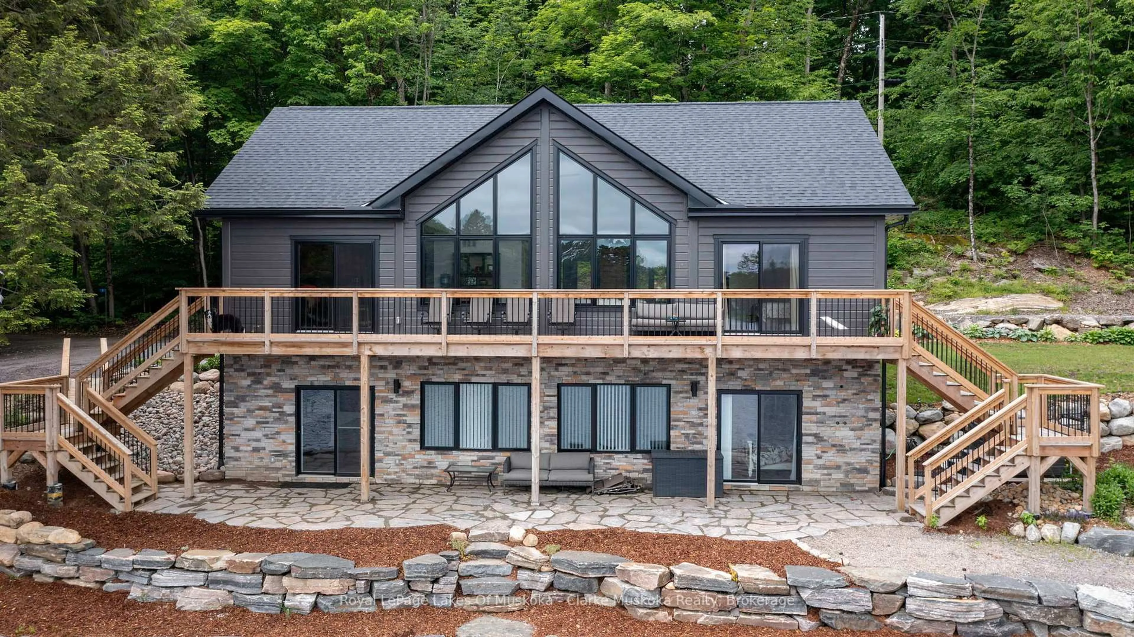 Home with brick exterior material, mountain view for 1044 Youngs Rd Unit #3 Rd, Muskoka Lakes Ontario P0B 1J0