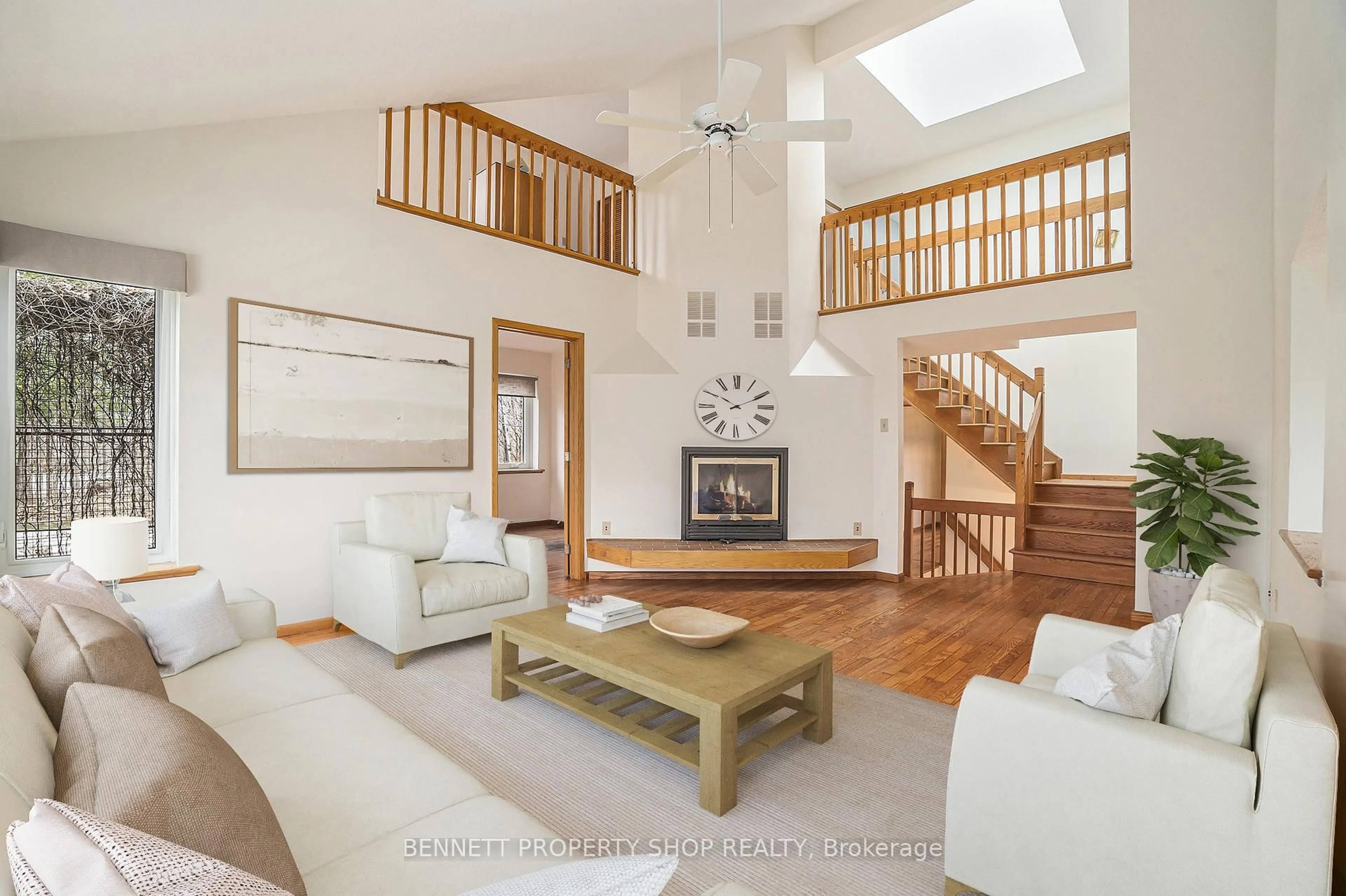 Living room with furniture, wood/laminate floor for 108 Mohill Cres, Ottawa Ontario K0A 1T0