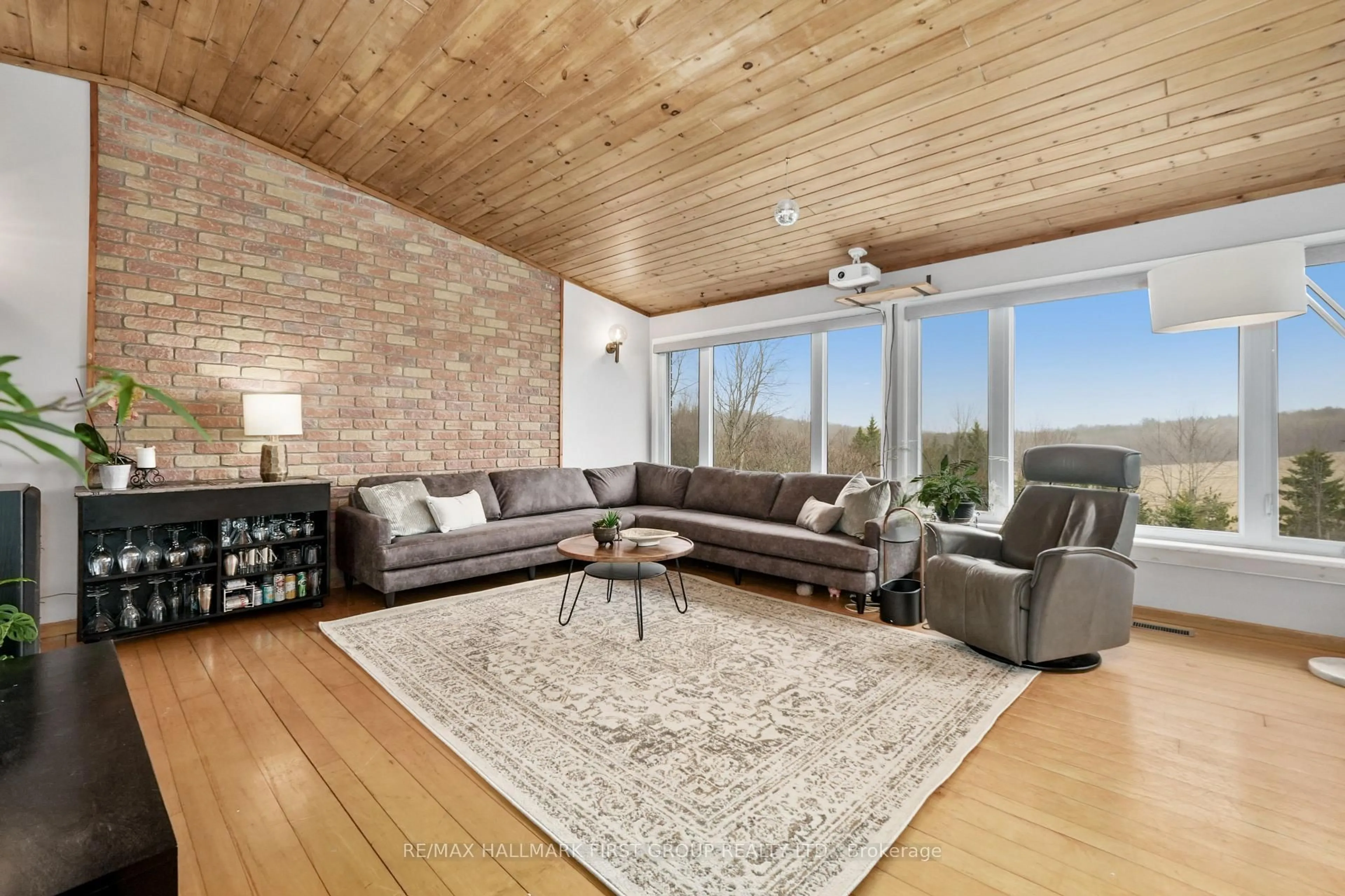 Living room with furniture, wood/laminate floor for 165 South Burns Rd, Hamilton Township Ontario K0K 1C0