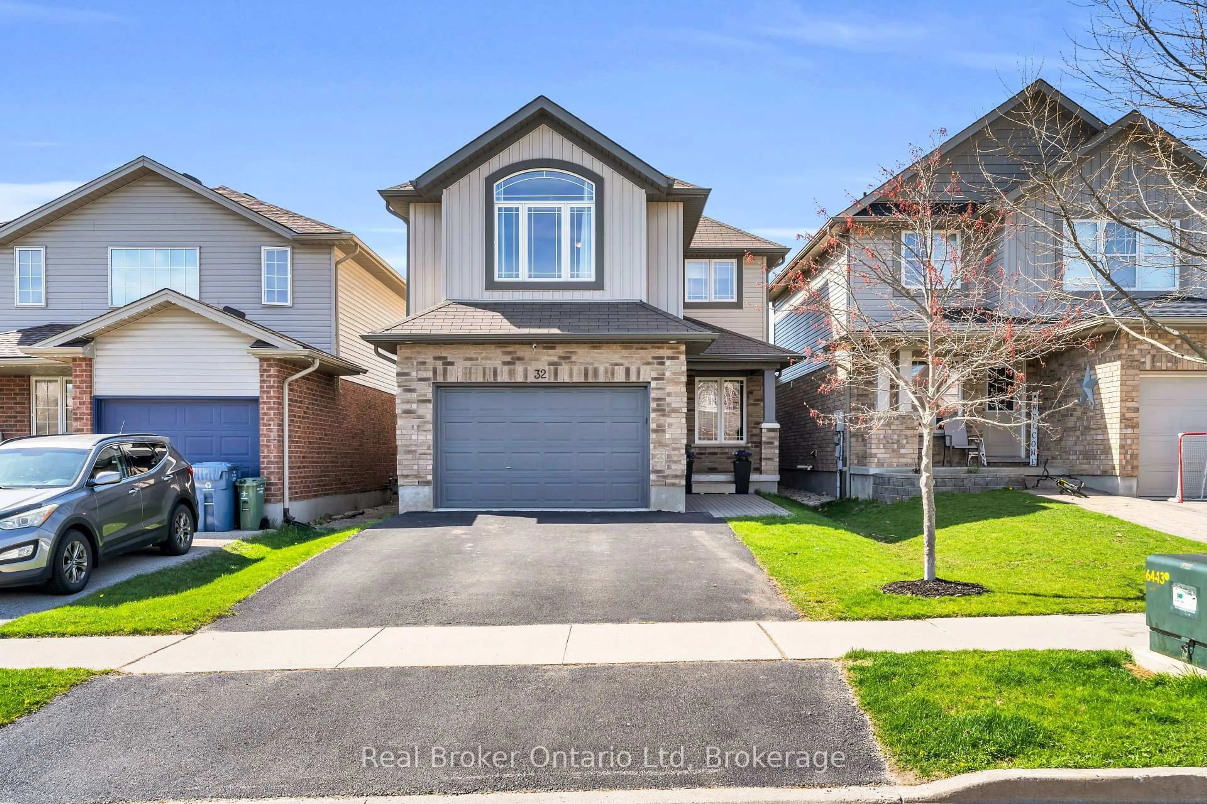 Home with brick exterior material, street for 32 Maude Lane, Guelph Ontario N1E 0G3