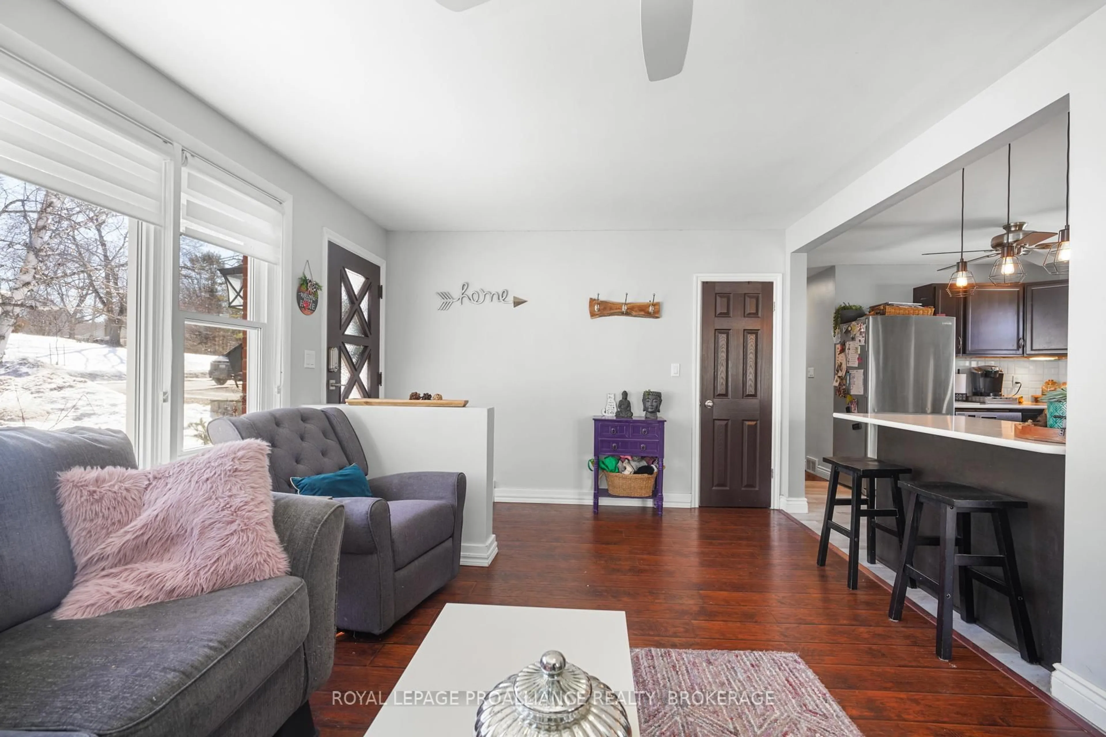 Living room with furniture, wood/laminate floor for 170 Indian Rd, Kingston Ontario K7M 1T4