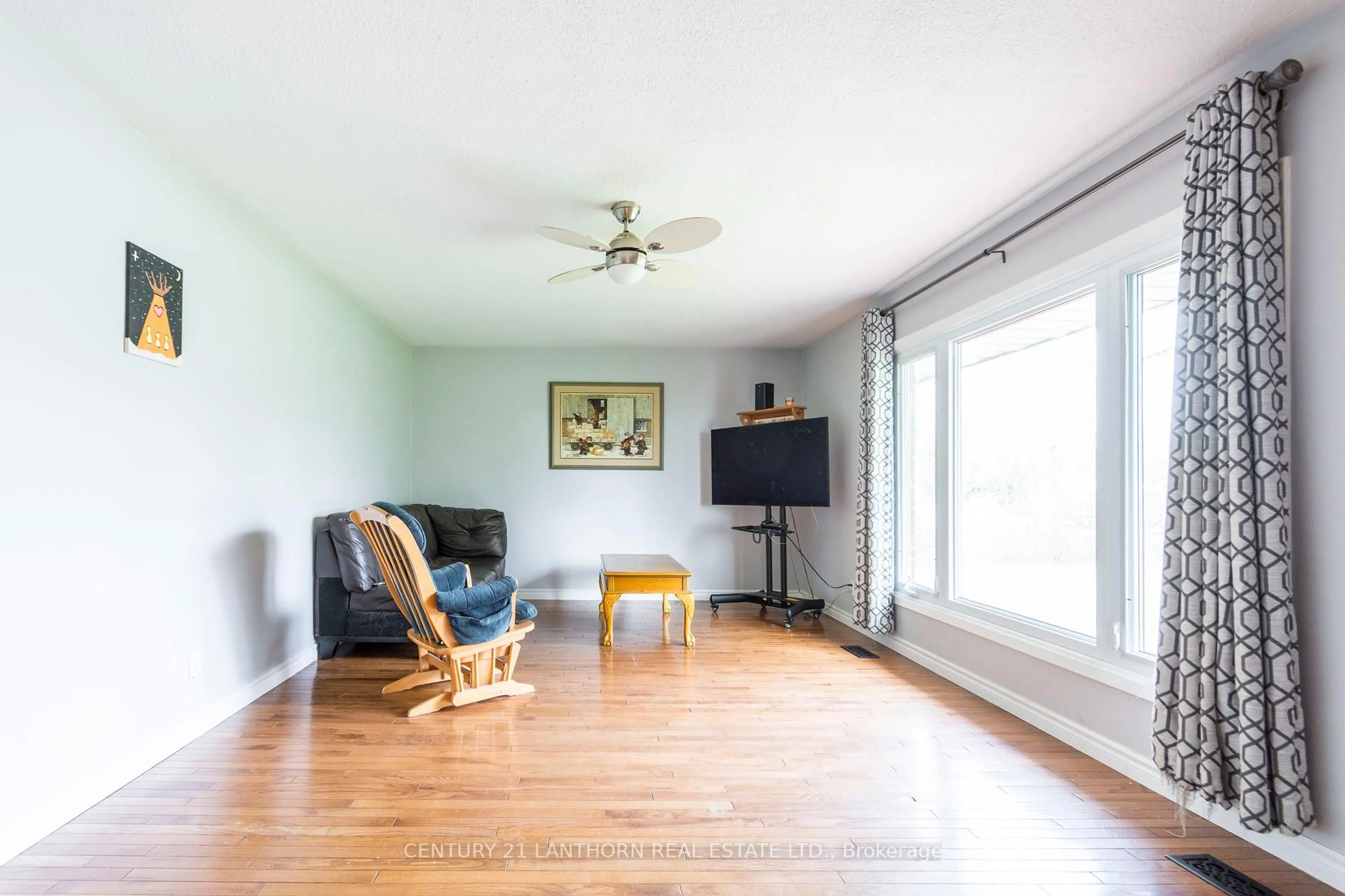 Living room with furniture, wood/laminate floor for 26 Old Stone Rd, Quinte West Ontario K8R 1E3