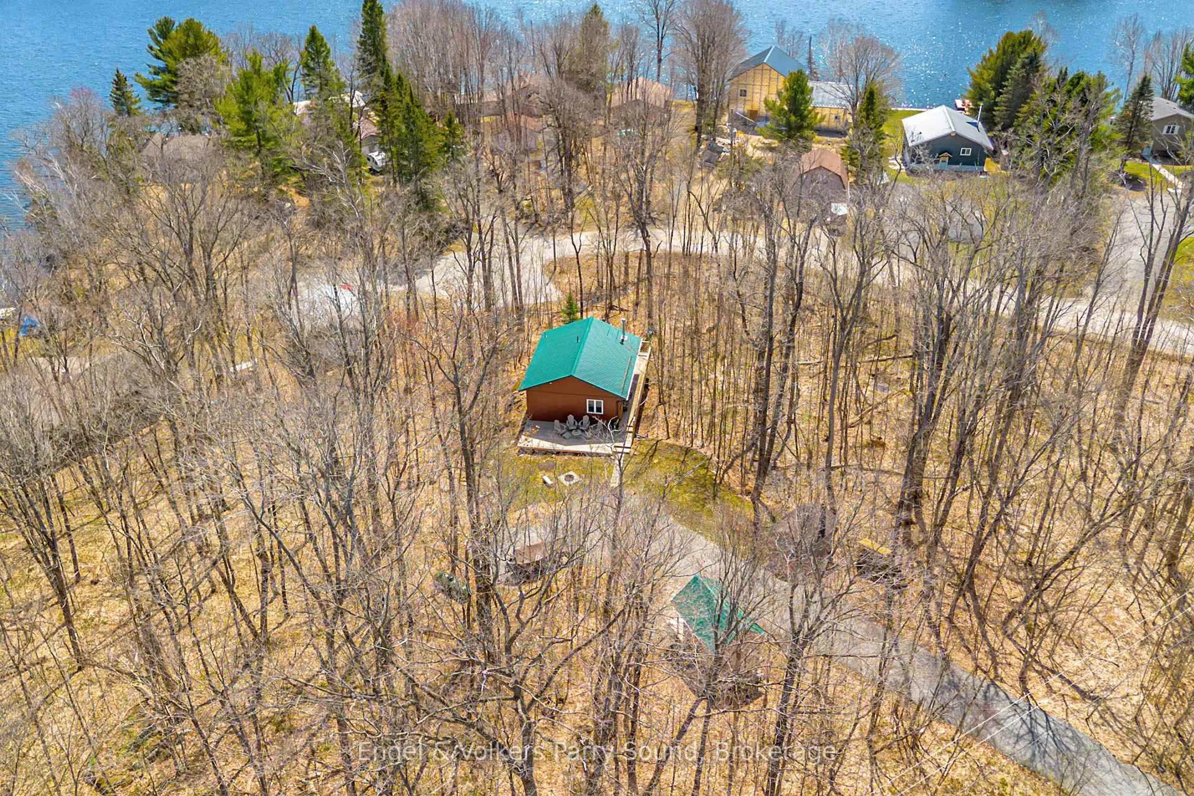 A pic from outside/outdoor area/front of a property/back of a property/a pic from drone, water/lake/river/ocean view for 107 Pinewood Rd, McDougall Ontario P2A 2W7