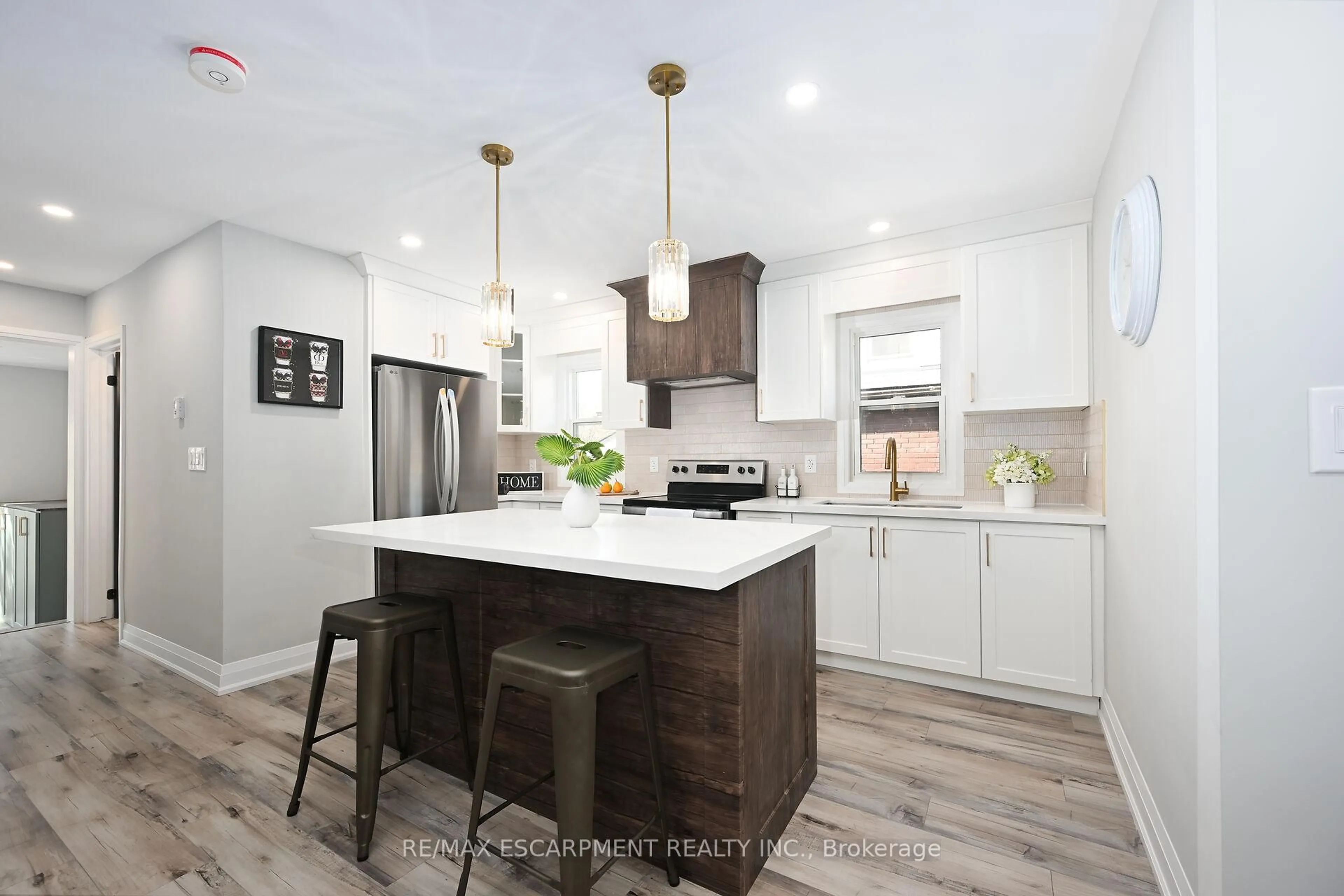 Open concept kitchen, wood/laminate floor for 282 Ottawa St, Hamilton Ontario L8K 2G1