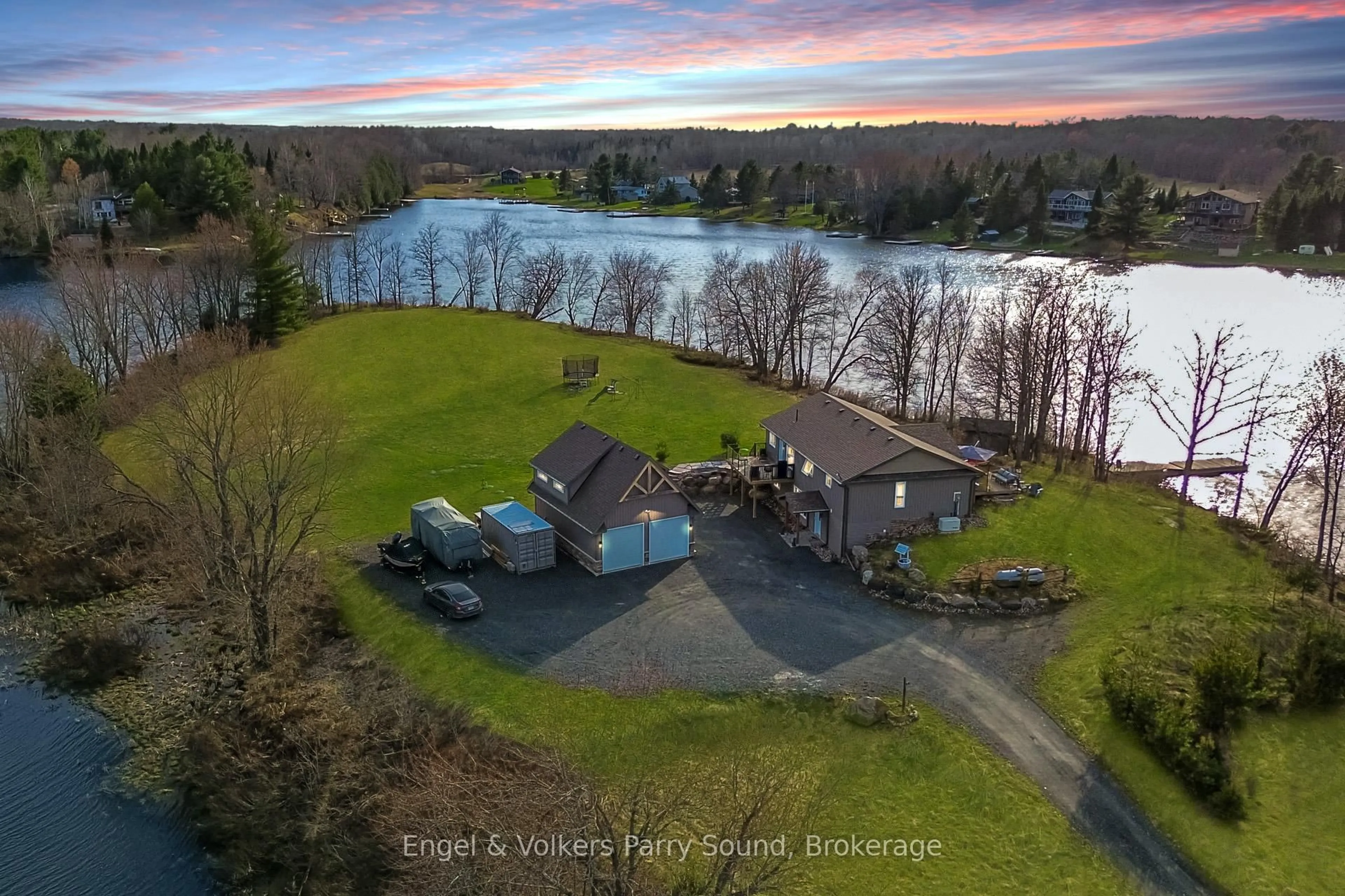 A pic from outside/outdoor area/front of a property/back of a property/a pic from drone, water/lake/river/ocean view for 7 Willow Lane, McKellar Ontario P0G 1C0