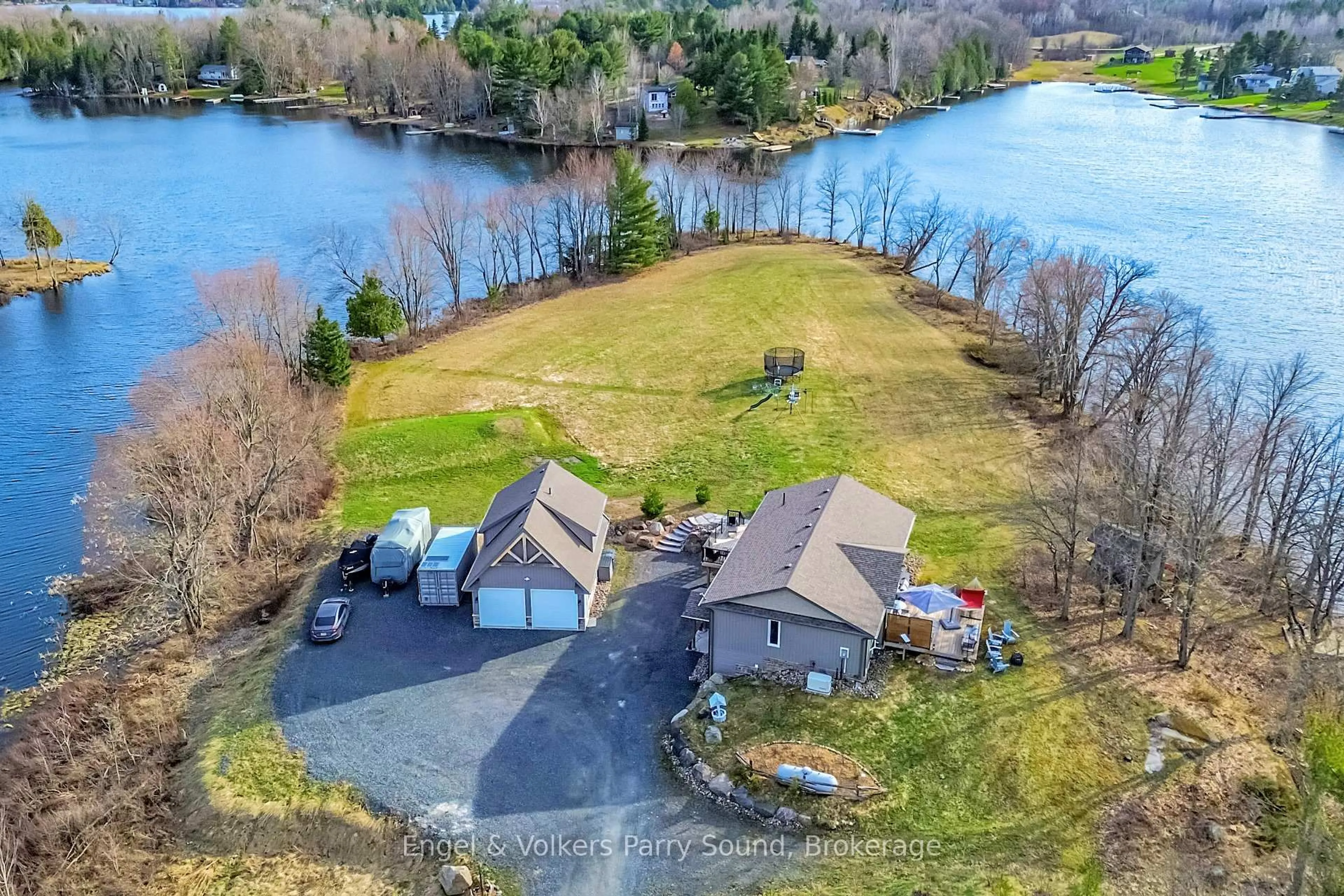 A pic from outside/outdoor area/front of a property/back of a property/a pic from drone, water/lake/river/ocean view for 7 Willow Lane, McKellar Ontario P0G 1C0