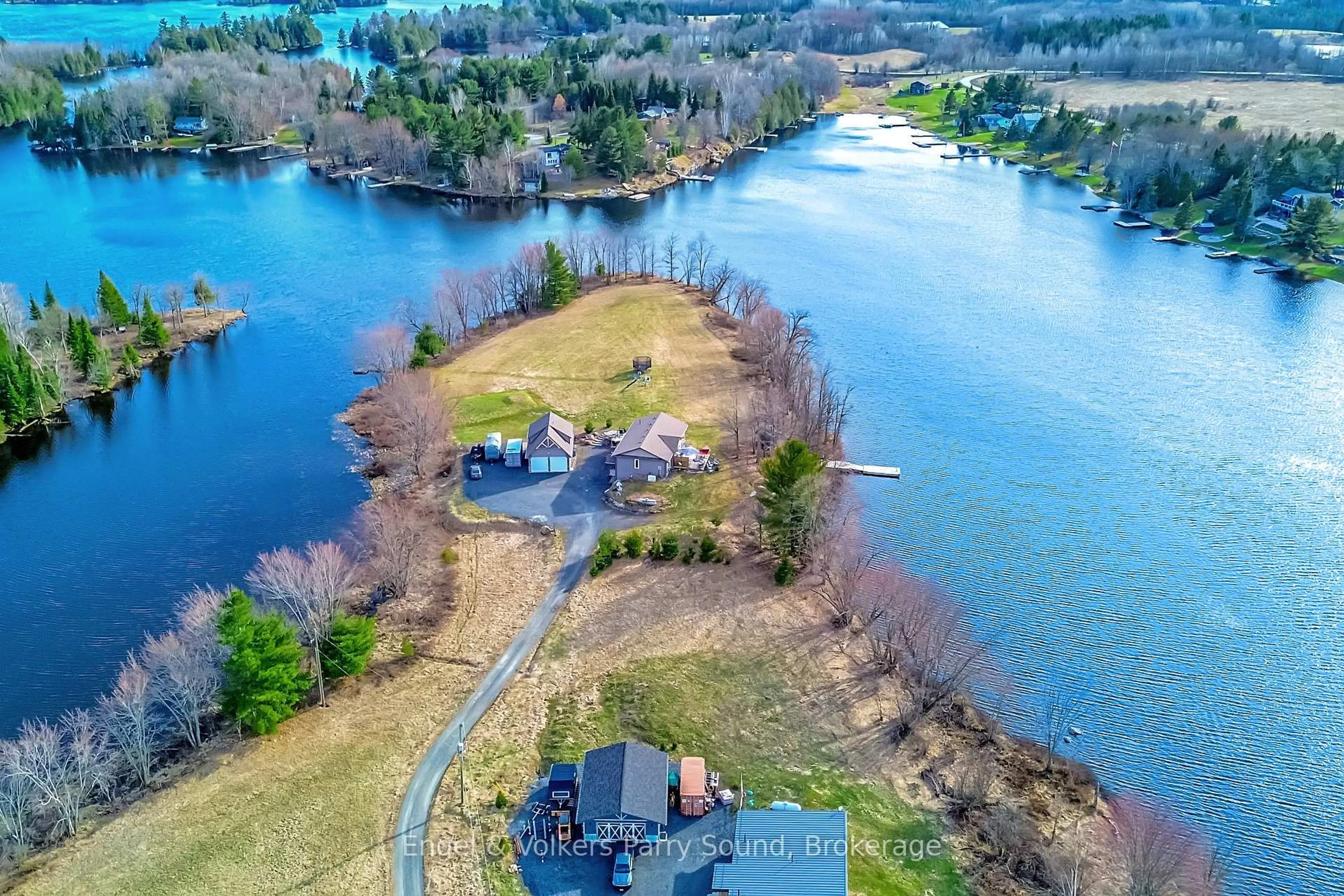 A pic from outside/outdoor area/front of a property/back of a property/a pic from drone, water/lake/river/ocean view for 7 Willow Lane, McKellar Ontario P0G 1C0