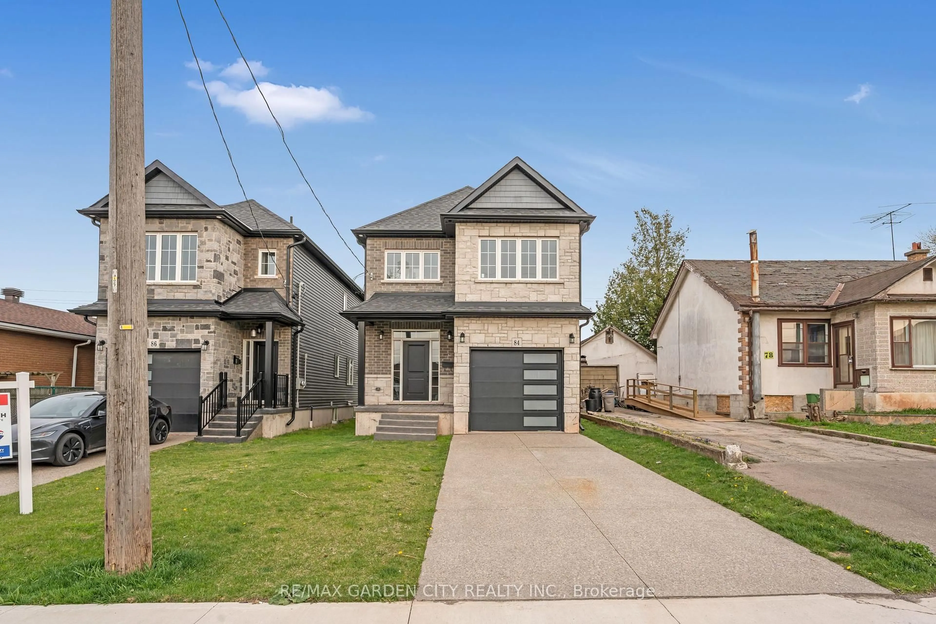 Home with brick exterior material, street for 84 Beland Ave, Hamilton Ontario L8H 6C1